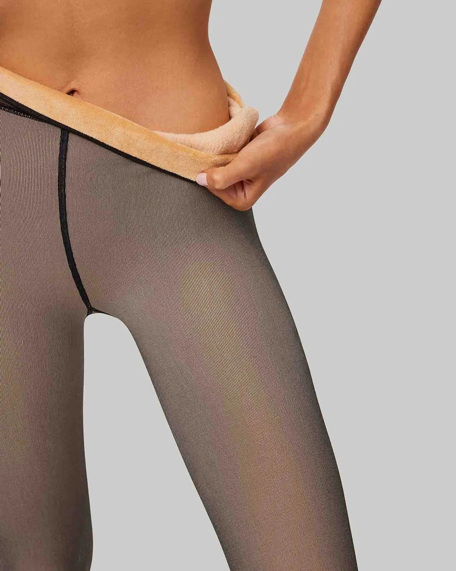 Warm nude fleece lined thermal tights with a sheer transparent black effect