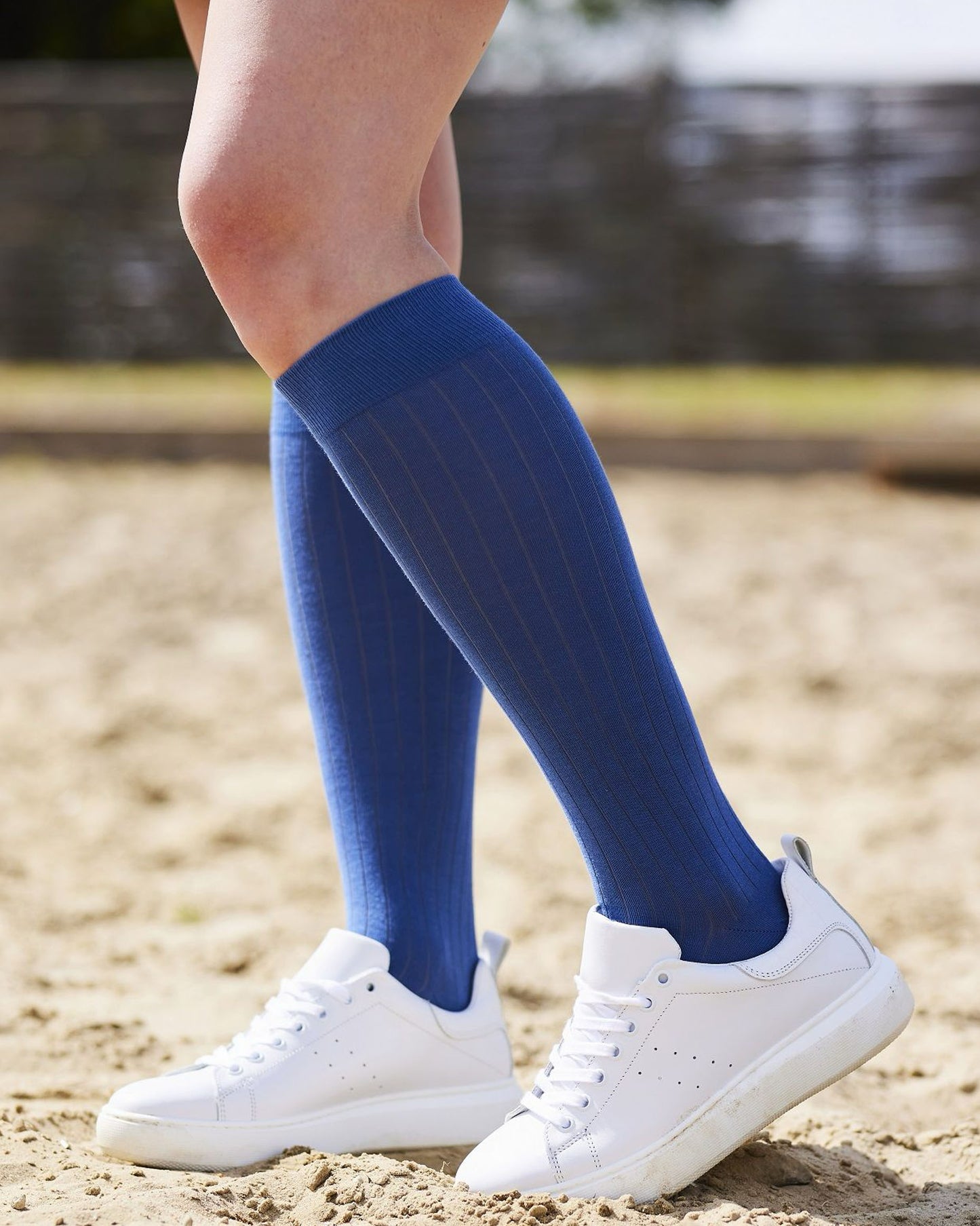 Bonnie Doon Rib Knee High Sock - Light navy blue knitted rib knee-high sock with shaped heel, flat toe seam and deep elasticated cuff. Worn with white leather sneakers.