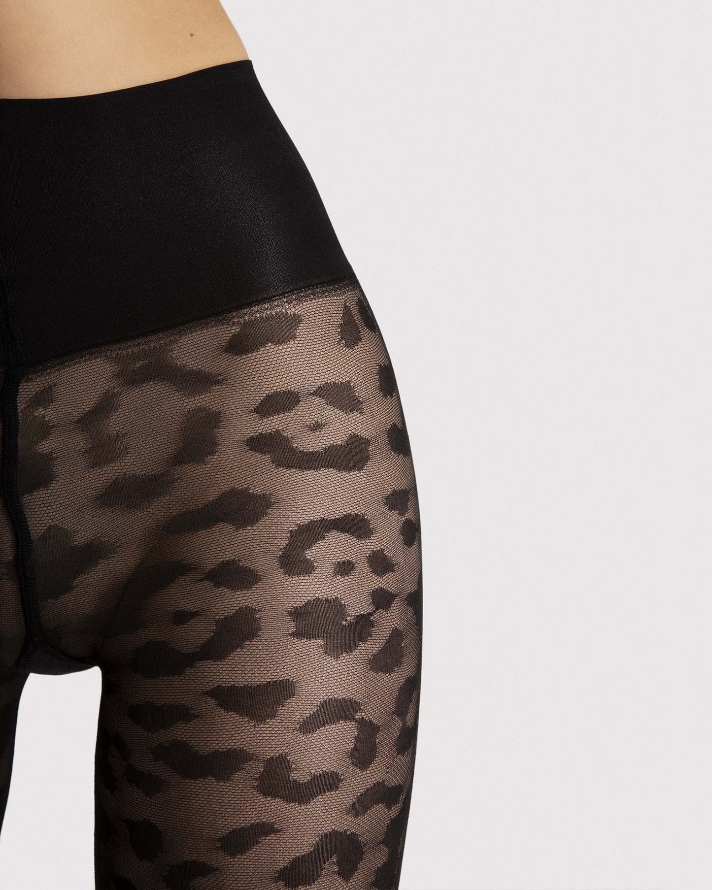 Fiore Echo Leopard Tights - Black micro mesh semi-sheer fashion tights with a woven panther animal print style pattern with a extra deep slimming waist band. Close up detail.