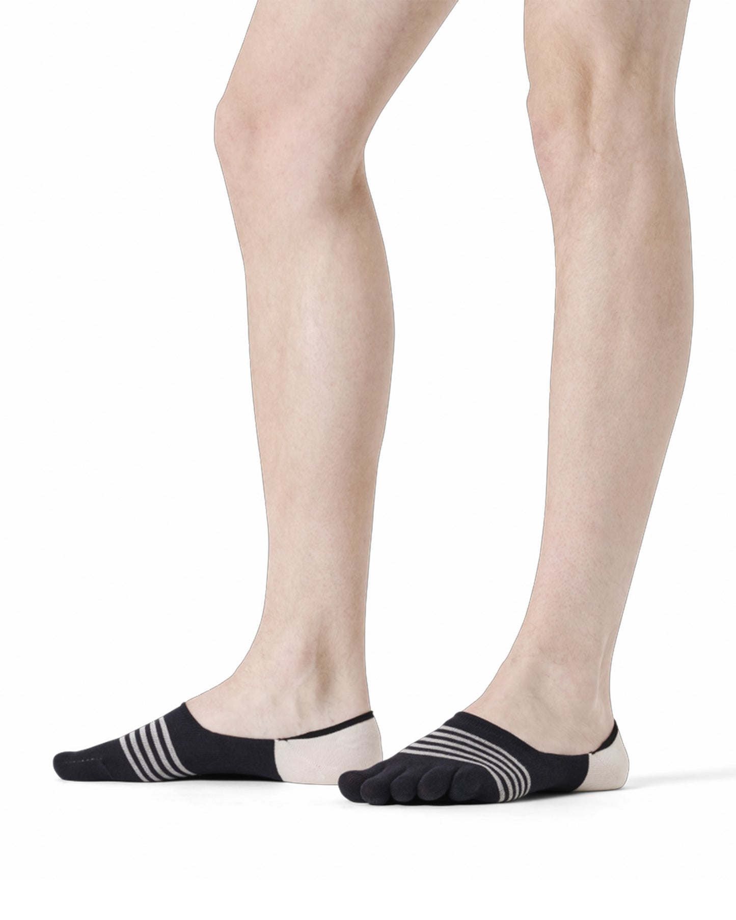 Black and white striped socks worn by a person on a white background
