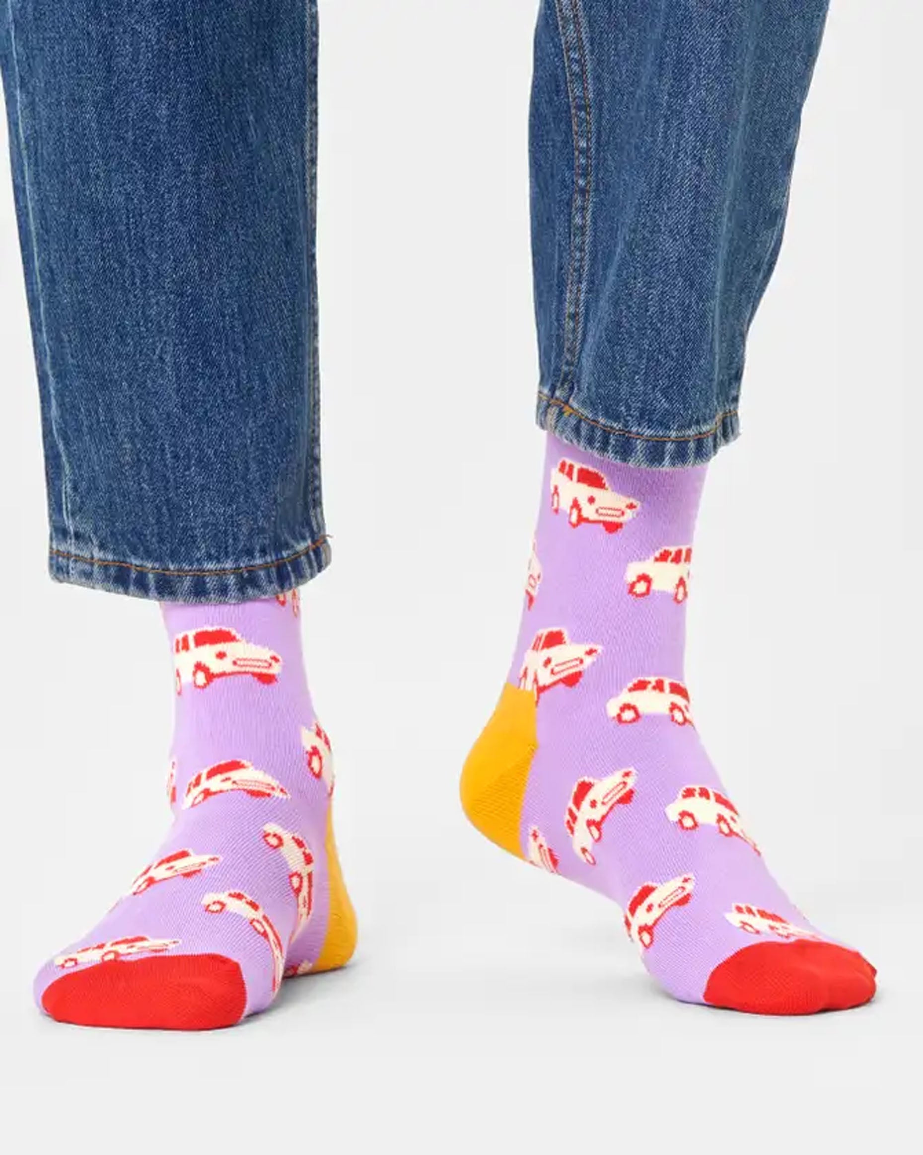 Happy Socks Car Sock - Lilac cotton crew length ankle socks with a vintage car pattern in cream and red, wine coloured cuff, mustard heel and red toe worn with blue denim jeans.