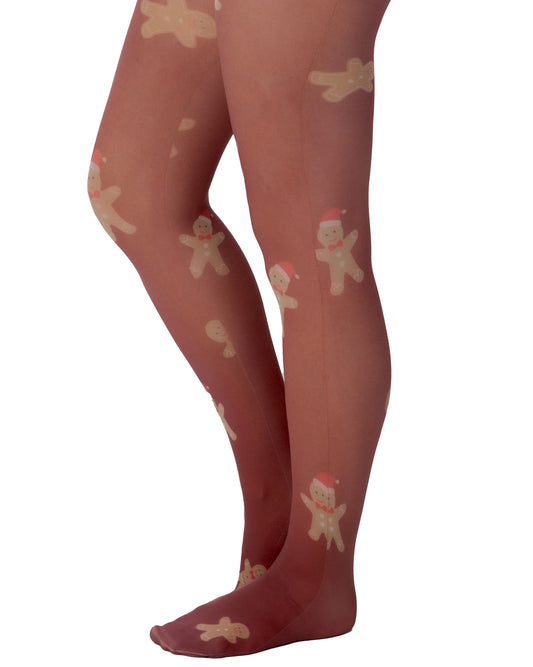 Pamela Mann Gingerbread Tights - White opaque fashion tights with an all over gingerbread man pattern with burgundy coloured background. Side view.