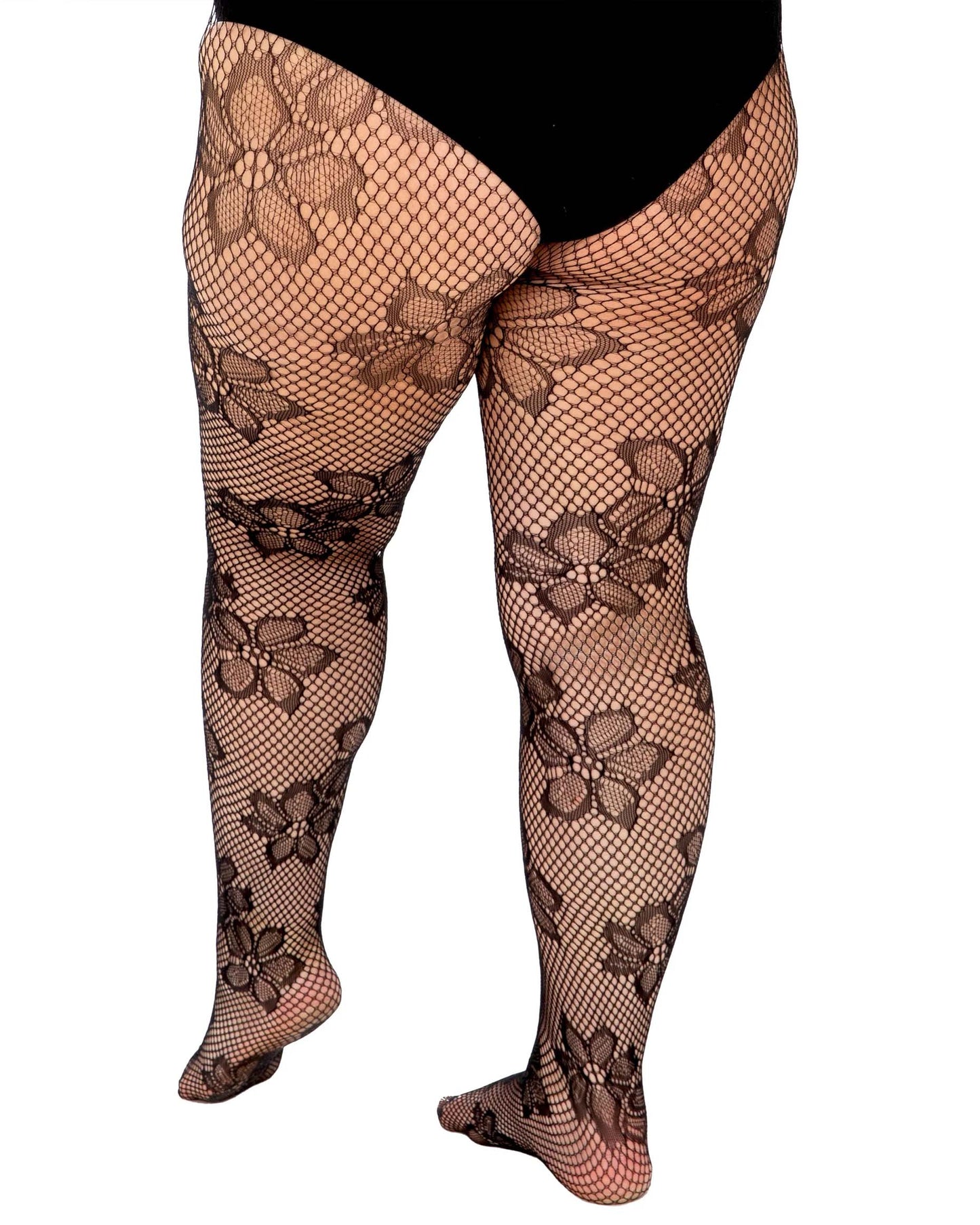 Pamela Mann Blossom Net Tights - Super stretch black openwork seamless fishnet tights with a floral design pattern. Back view.