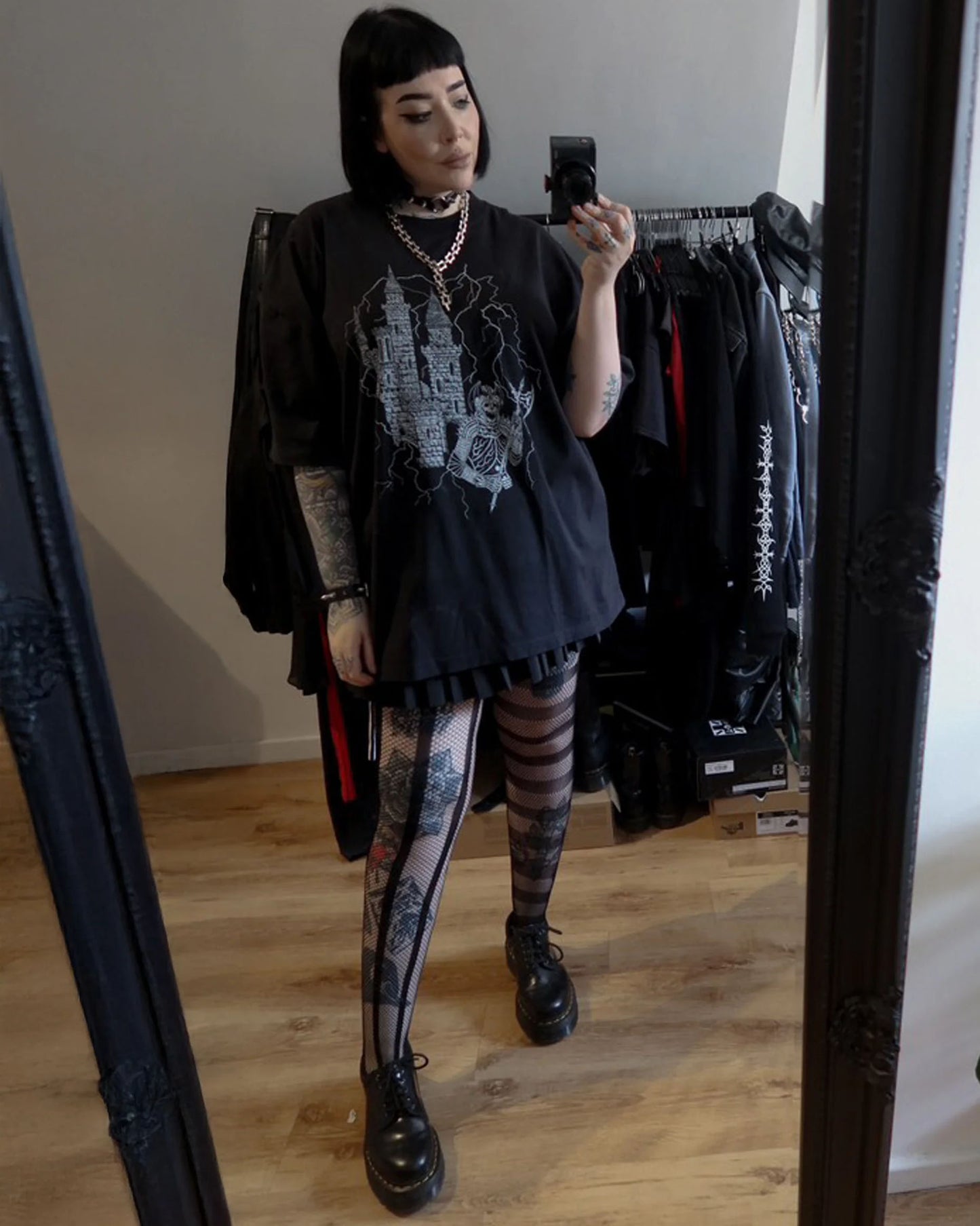 Pamela Mann Opposite Net Tights - Soft openwork mismatched tights featuring vertical stripes on one leg and horizontal on the other, worn with black Dr. Marten's shoes and gothic print t-shirt