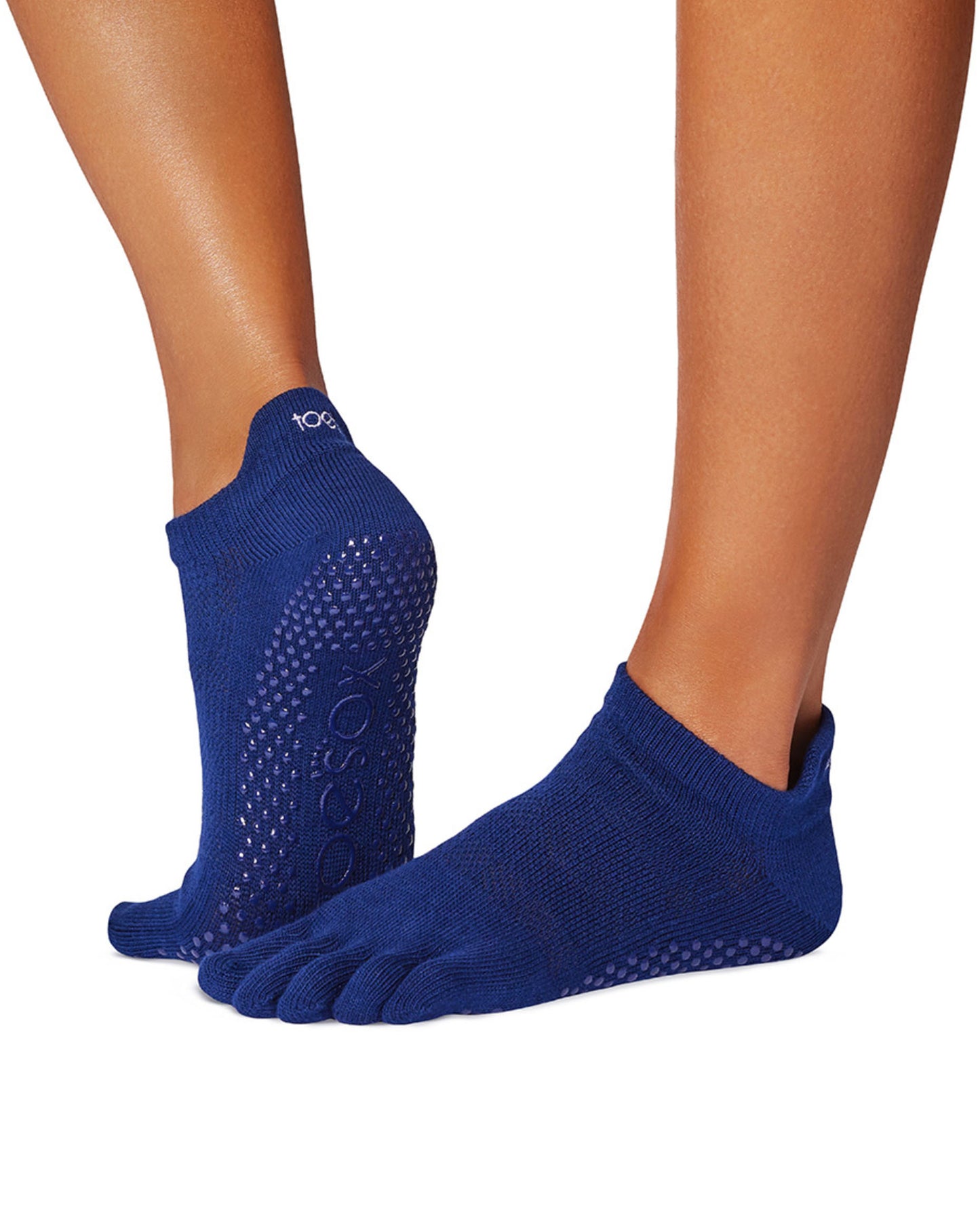 ToeSox Low Rise F/T Sock - Navy blue cotton socks with individual toes and gripper sole with a geometric self pattern, side view.