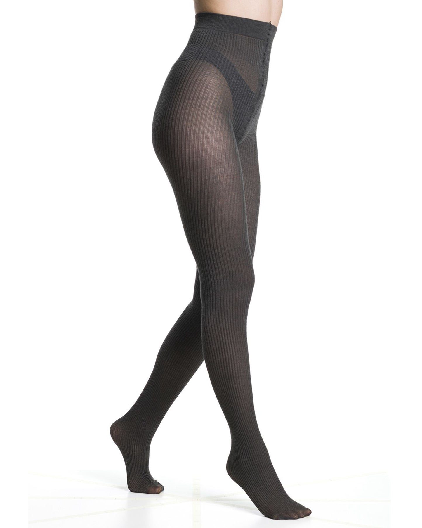 Dark grey ribbed knitted tights worn by a person on a white background