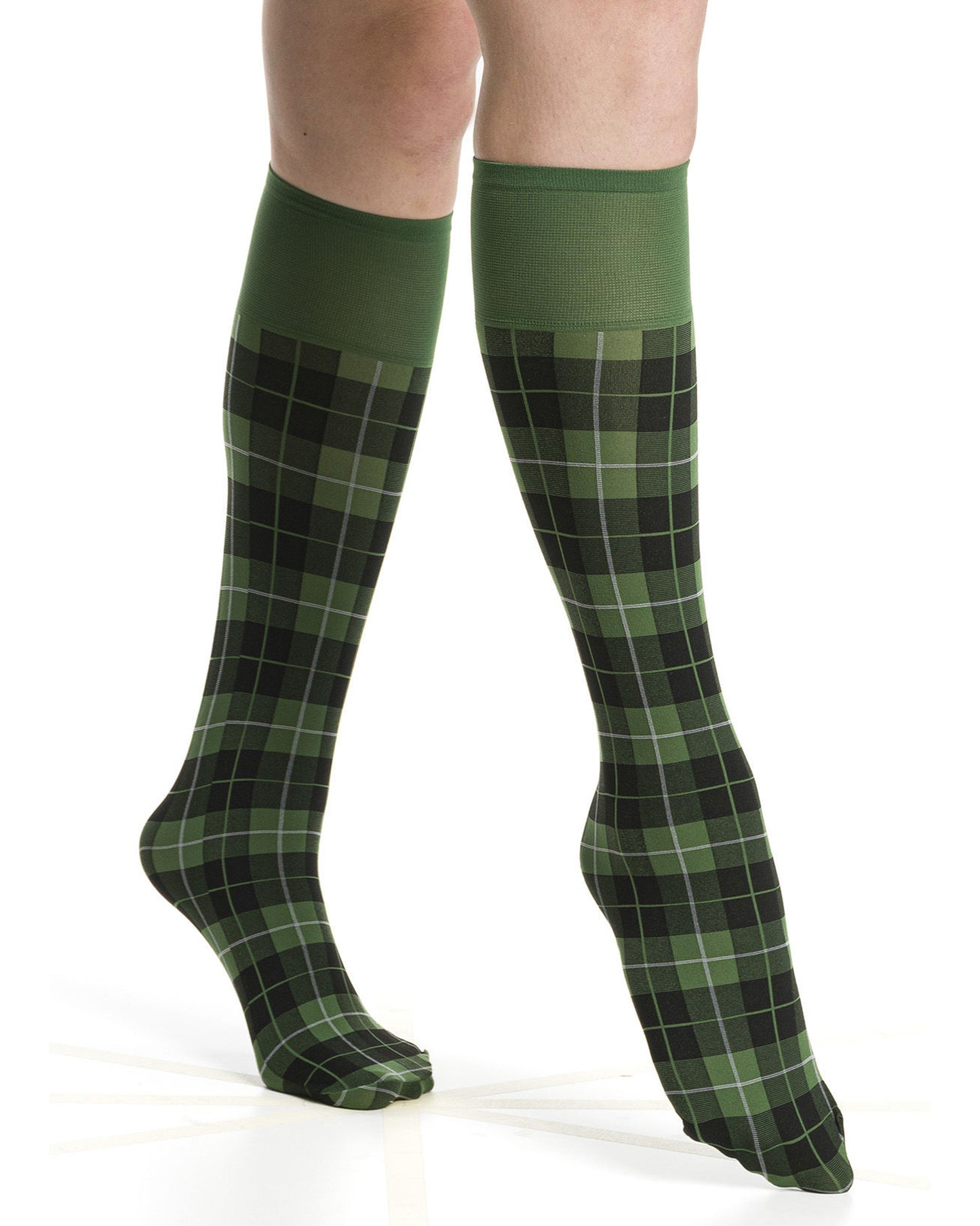 Olive green plaid knee-high socks on a white background