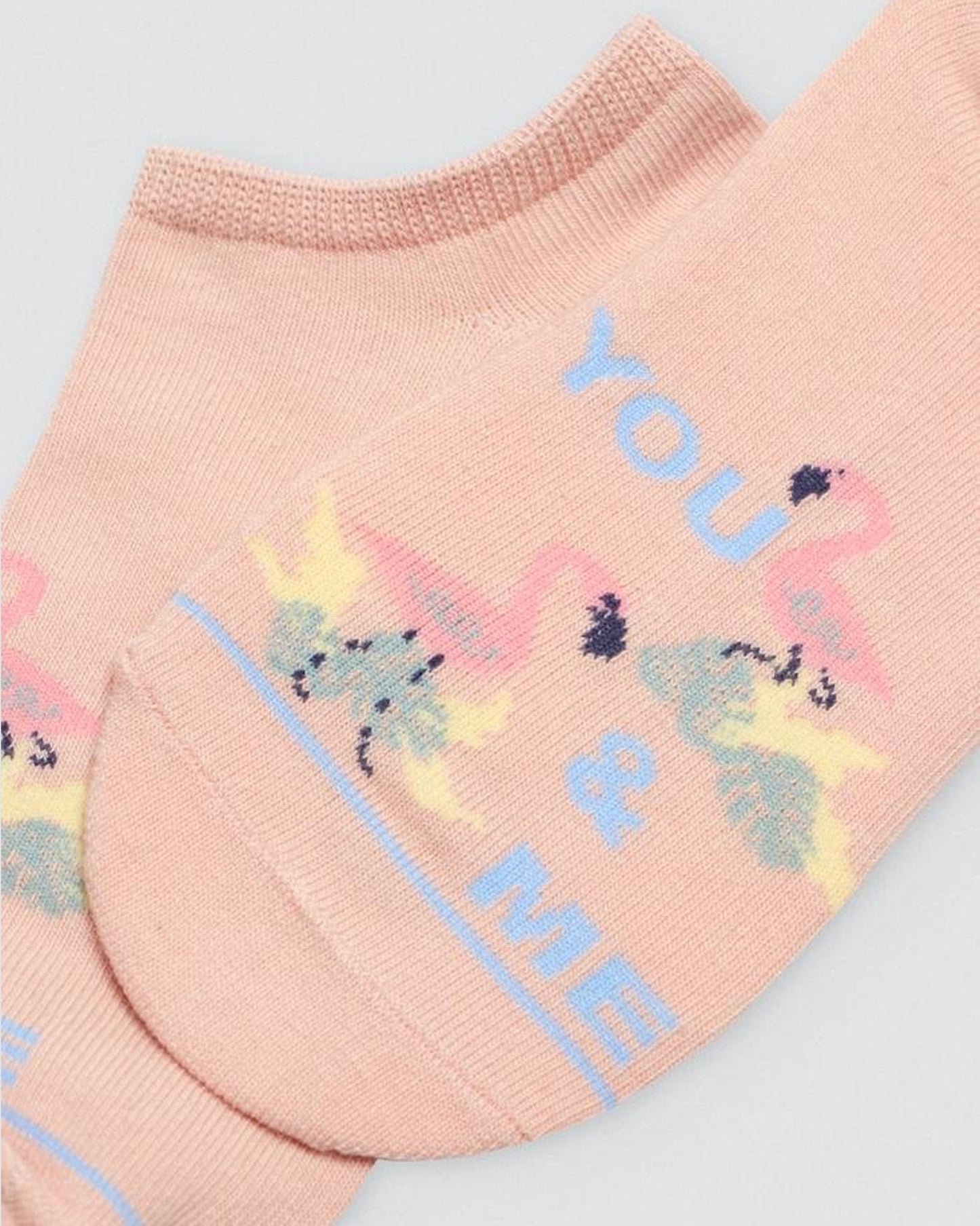 Ysabel Mora Flamingo Sock - Peach coloured low ankle cotton socks with a couple of flamingos and "you & me" text motif on the front. Close up detail.