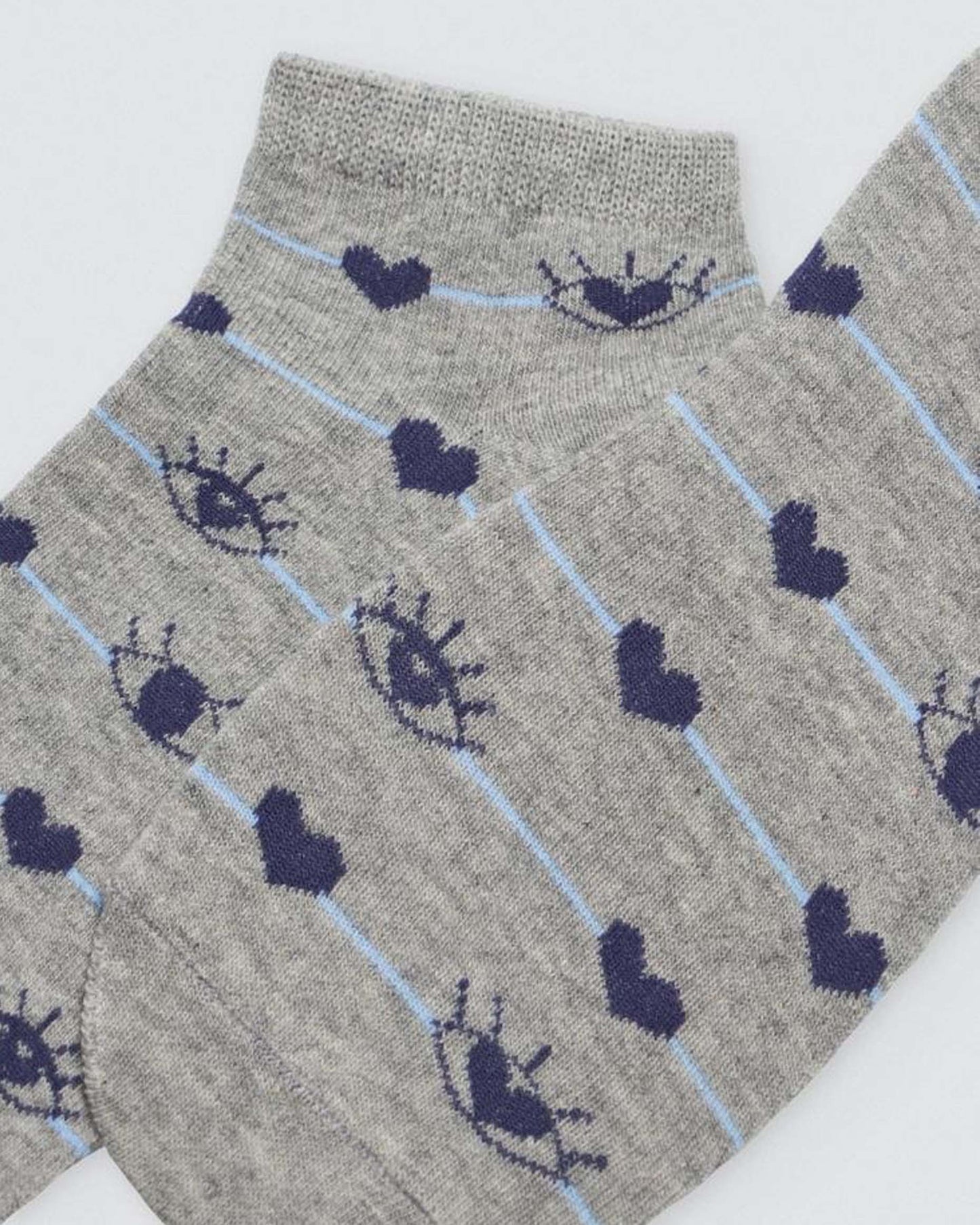 Ysabel Mora Heart & Eye Socks - Low ankle cotton socks with a navy heart and eyes pattern on a thin light blue stripe. Close up.