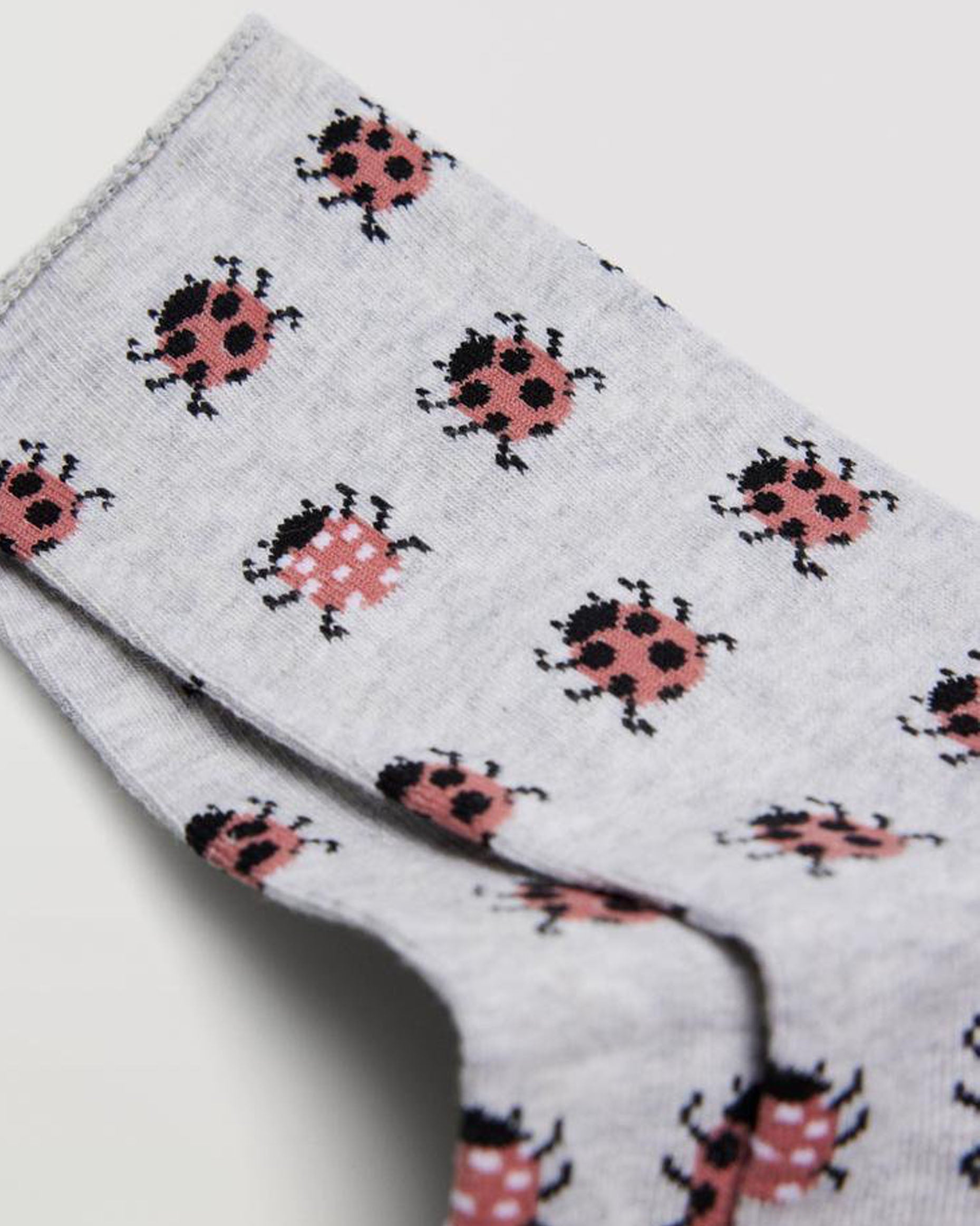 Ysabel Mora 12889 Ladybird Socks - Light grey cotton socks with an all over ladybird pattern in red and black, shaped heel, flat toe seam and no cuff edge roll.