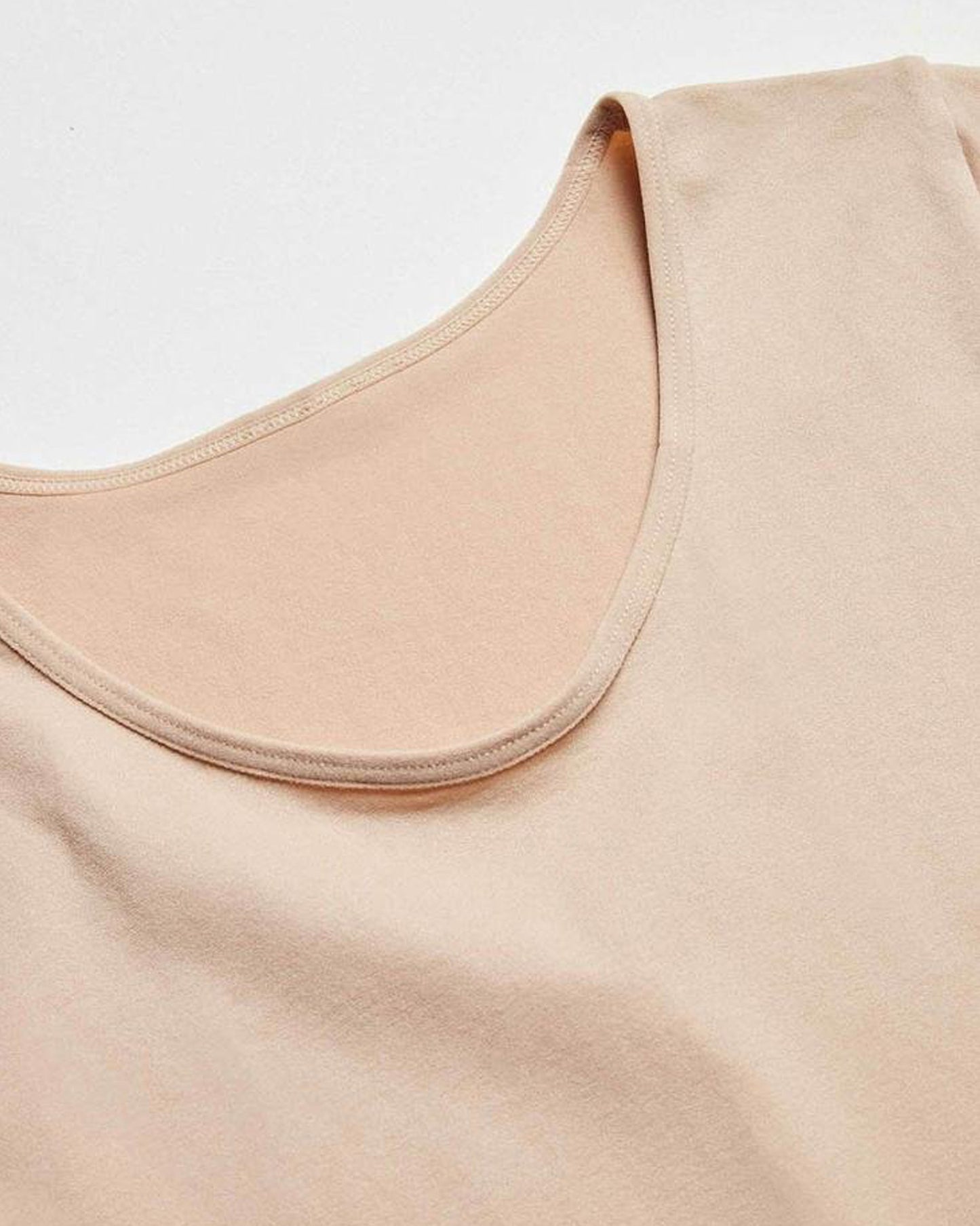 Ysabel Mora Long Sleeve Top - nude/beige soft and stretchy microfibre top with round neck and long sleeves, close up of crew neck.