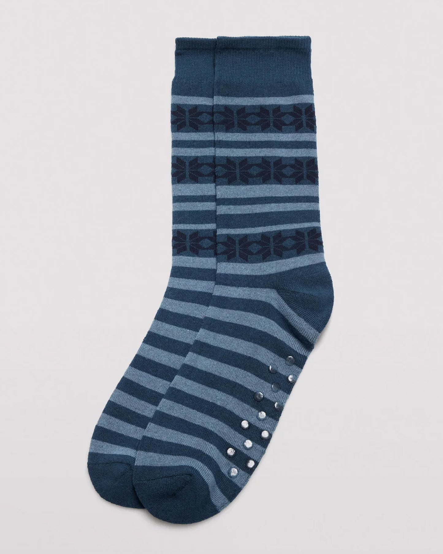 Ysabel Mora 22167 Snowflake Slipper Socks - Men's cotton crew length cotton ankle socks with a horizontal pattern of snowflakes and stripes in shades of blue and navy, dotted non-slip gripper sole, flat toe seam, shaped heel and deep comfort cuff.