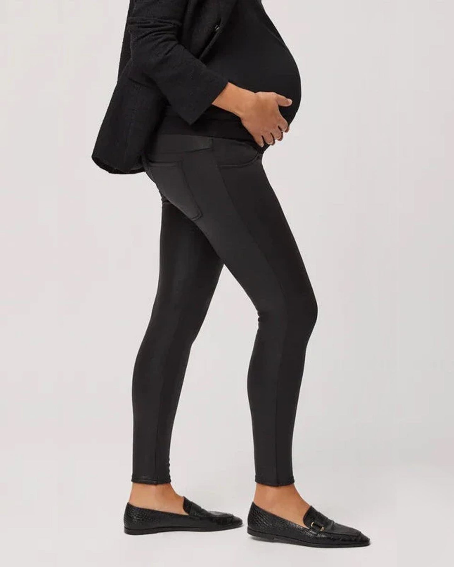 Ysabel Mora 70169 Thermal Maternity Leggings - Waxed finish trouser leggings with a warm fleece lining, back pockets and an extra wide elasticated waistband for a perfect fit on the tummy throughout pregnancy. Side view.