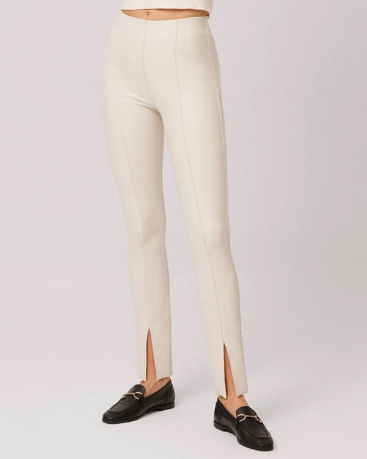 Ysabel Mora 70295 Faux Leather Slit Leggings - Tight fit faux leather thermal cream coloured leggings with a warm plush fleece lining, faux side pocket stitching, centre seam down the front of the leg with a slit opening at the cuff, worn with black loafers.