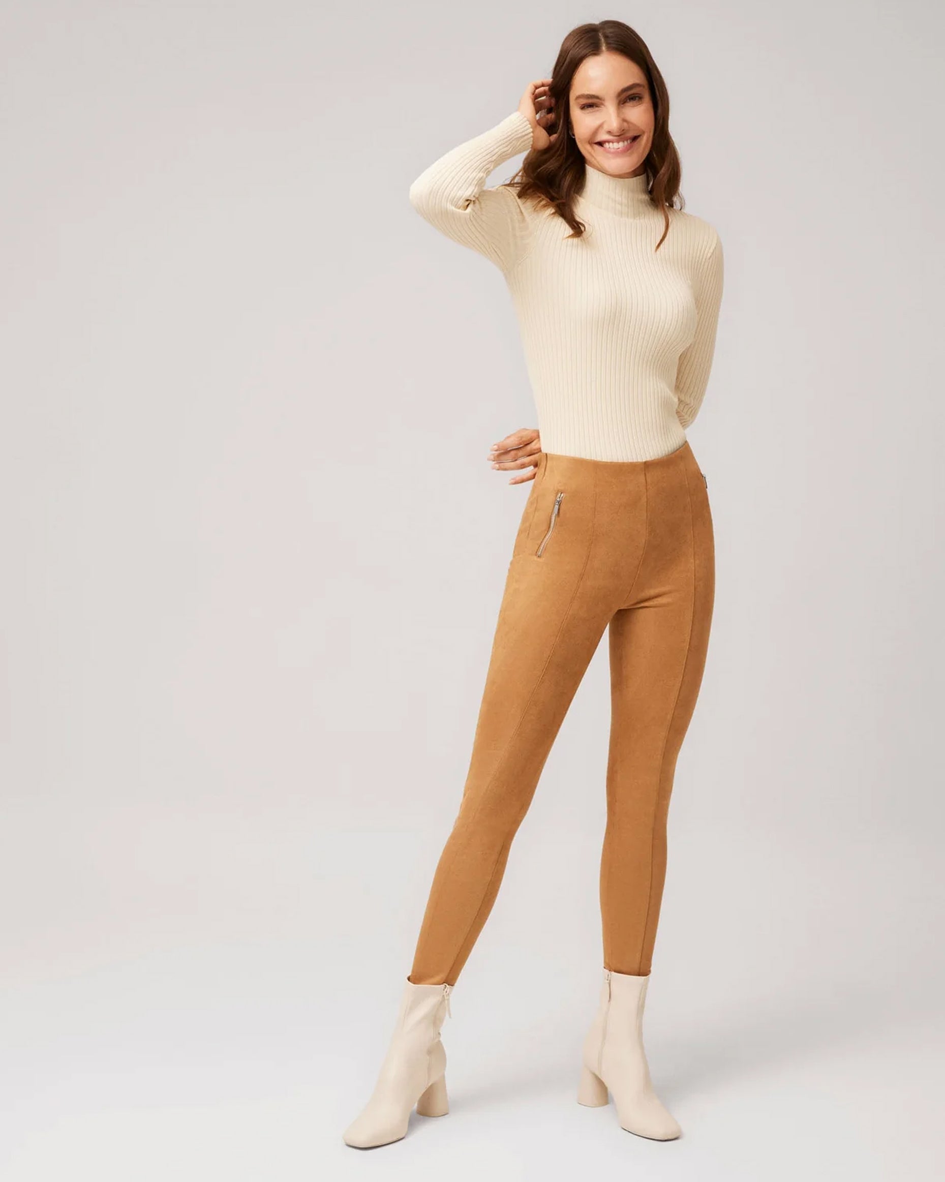 Ysabel Mora 70297 Faux Suede Leggings - Camel / tan plush velour suede effect high waisted trouser leggings, worn with ivory heeled ankle boots and cream turtle neck top.