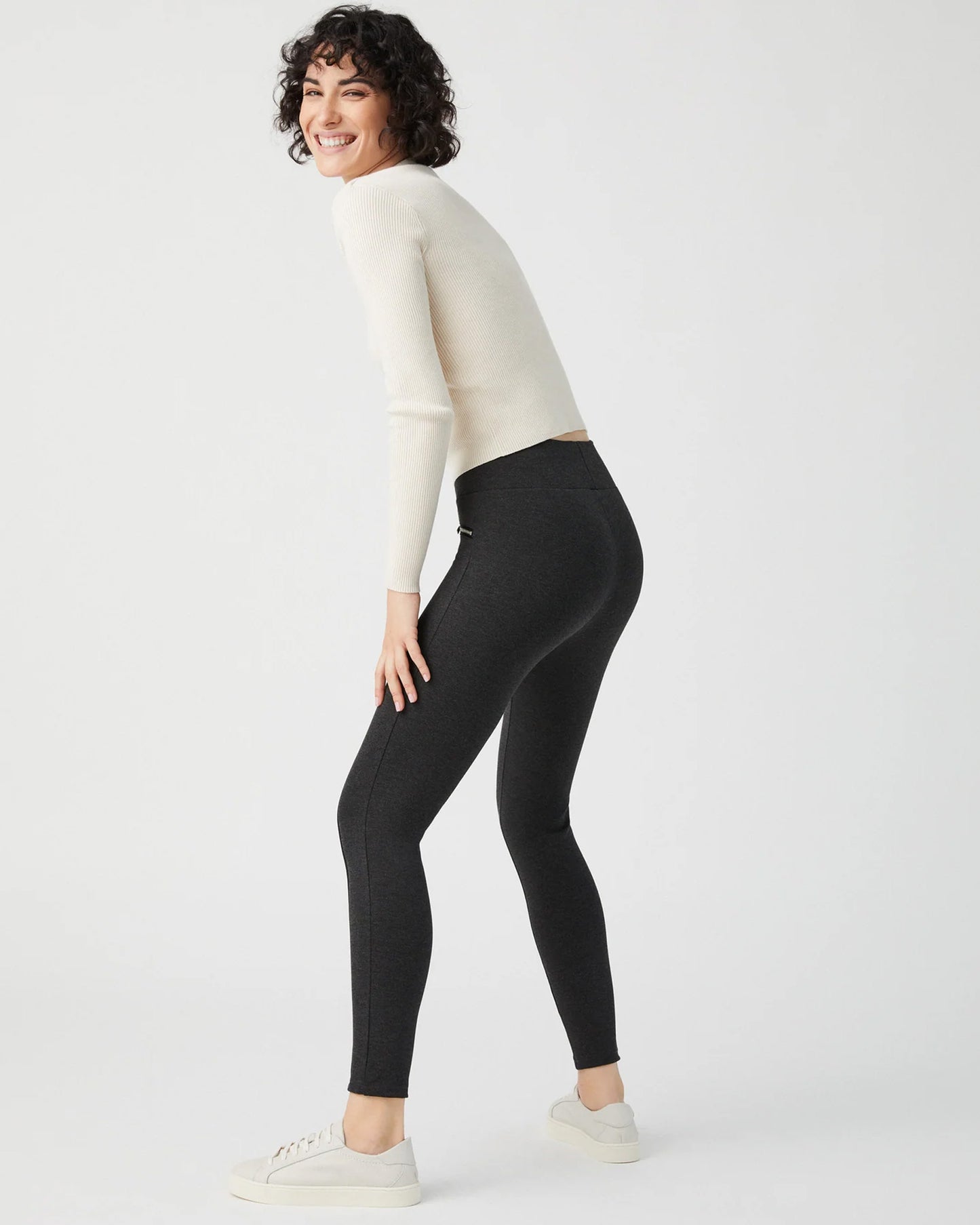 Ysabel Mora 70273 Leggings - Dark fleck grey jodhpur style high waisted leggings with silver side zips, raised centre seam down the leg and deep slimming waist band. Worn with cream ribbed sweater and sneakers.