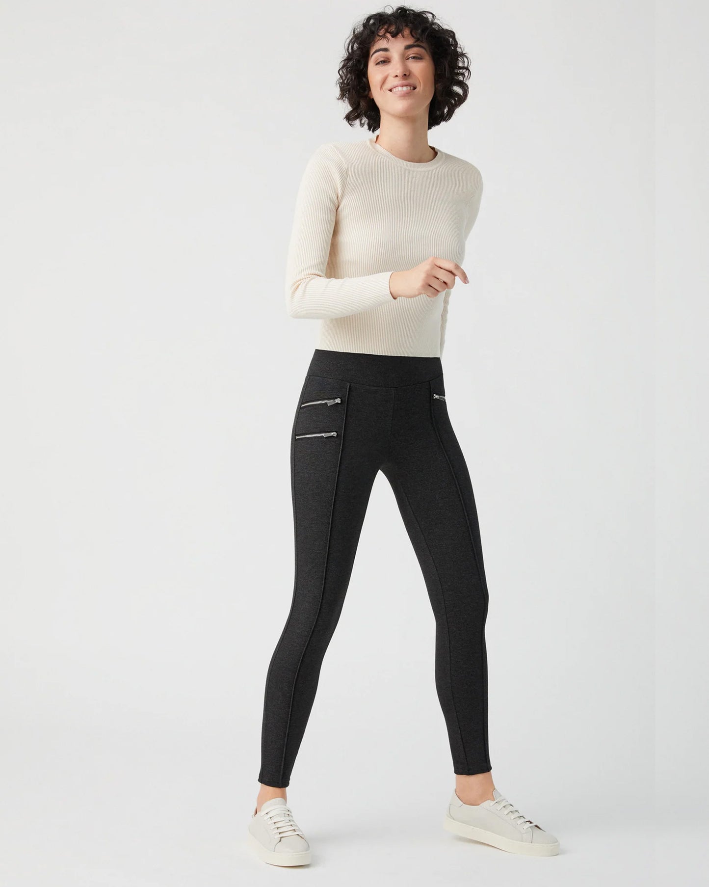 Ysabel Mora 70273 Leggings - Dark fleck grey jodhpur style high waisted leggings with silver side zips, raised centre seam down the leg and deep slimming waist band. Worn with cream jumper and leather sneakers.