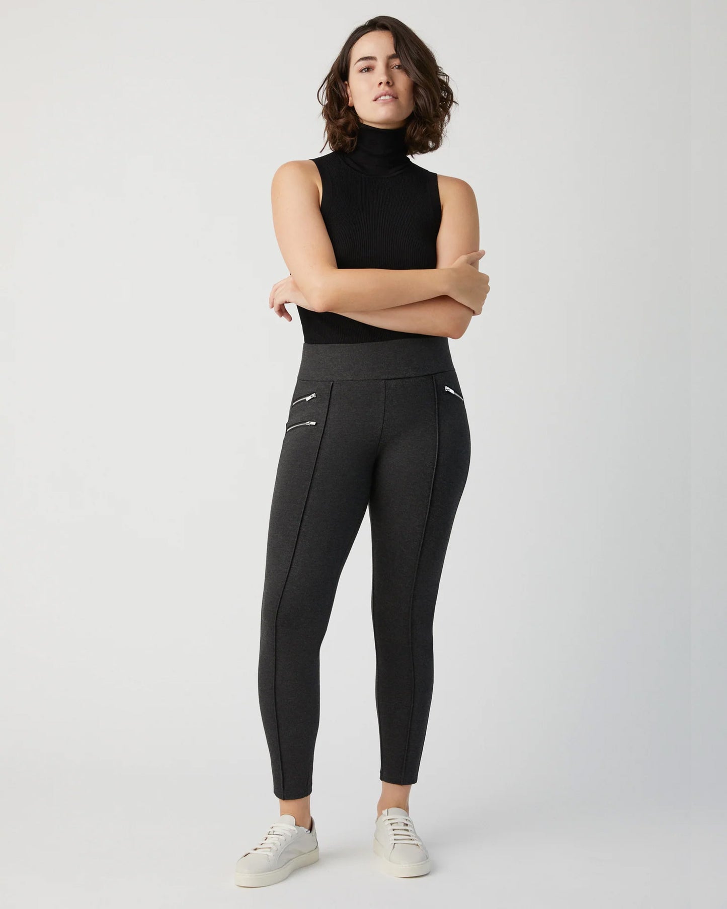 Ysabel Mora 70273 Leggings - Dark fleck grey jodhpur style high waisted leggings with silver side zips, raised centre seam down the leg and deep slimming waist band. Worn with black turtle neck top and white sneakers.