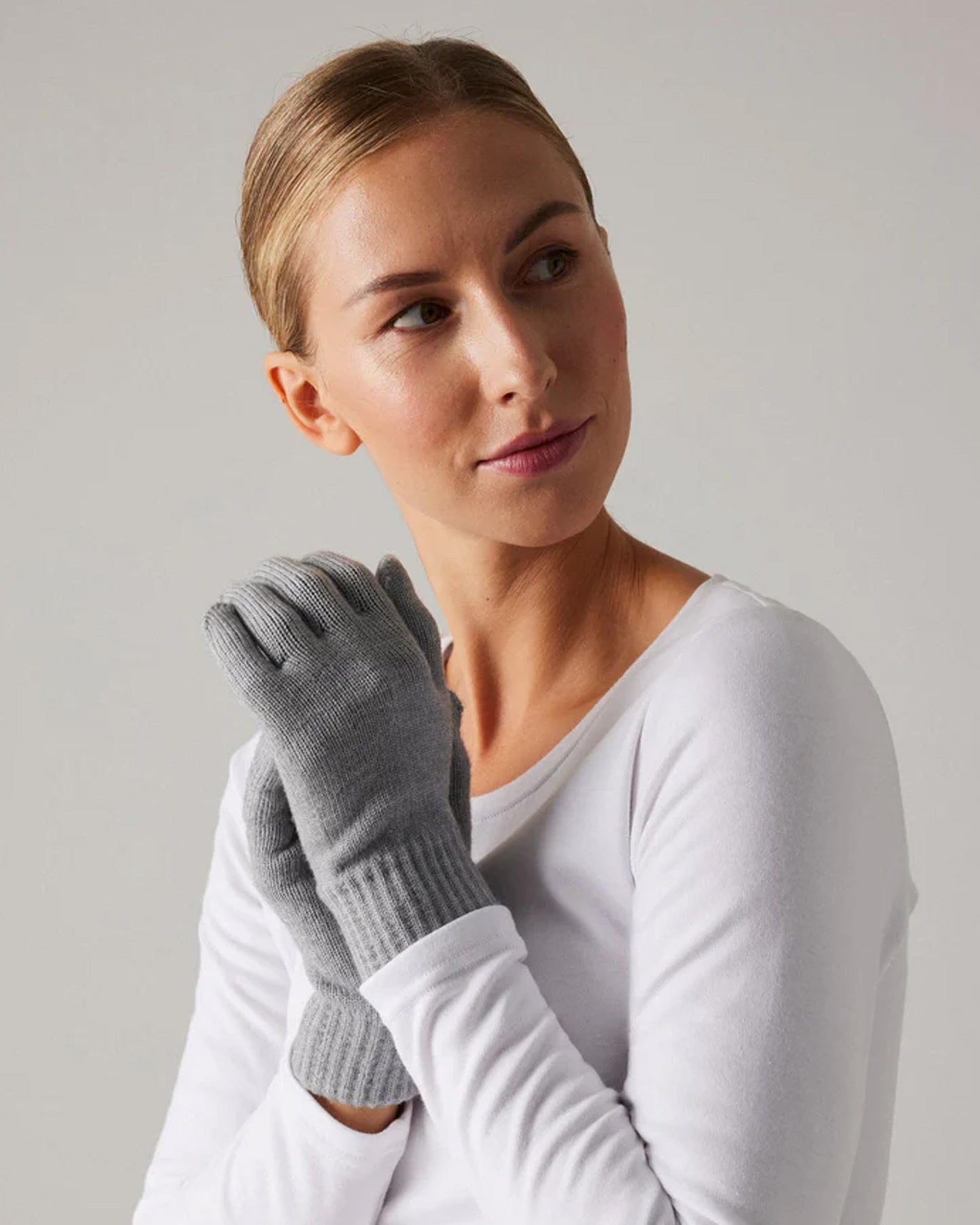 Ysabel Mora Knitted Gloves - Plain light grey knitted soft and warm knitted gloves with a deep elasticated cuff. Worn with white thermal top.