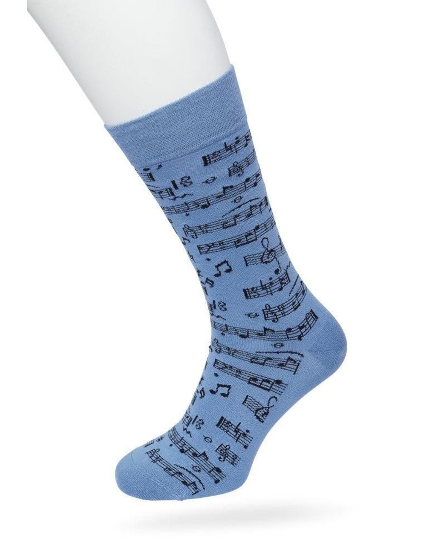 A light blue crew sock with a black musical staff and notes pattern, shown on a white mannequin leg against a white background.