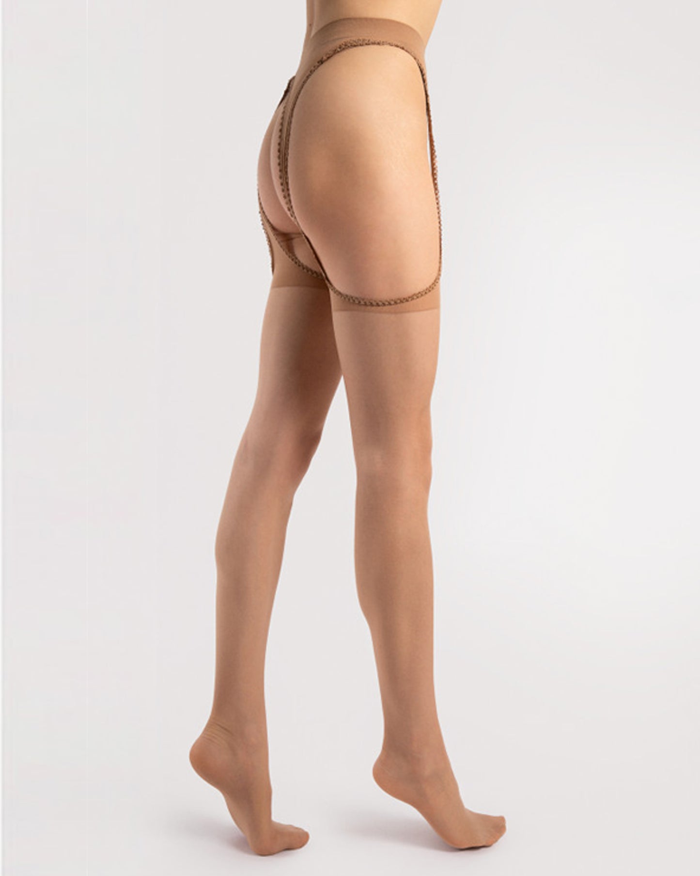 Fiore Amour O5030 - Sheer nude cut out suspender tights with built-in semi-opaque garter with scalloped edge and sheer reinforced toe. Side view.