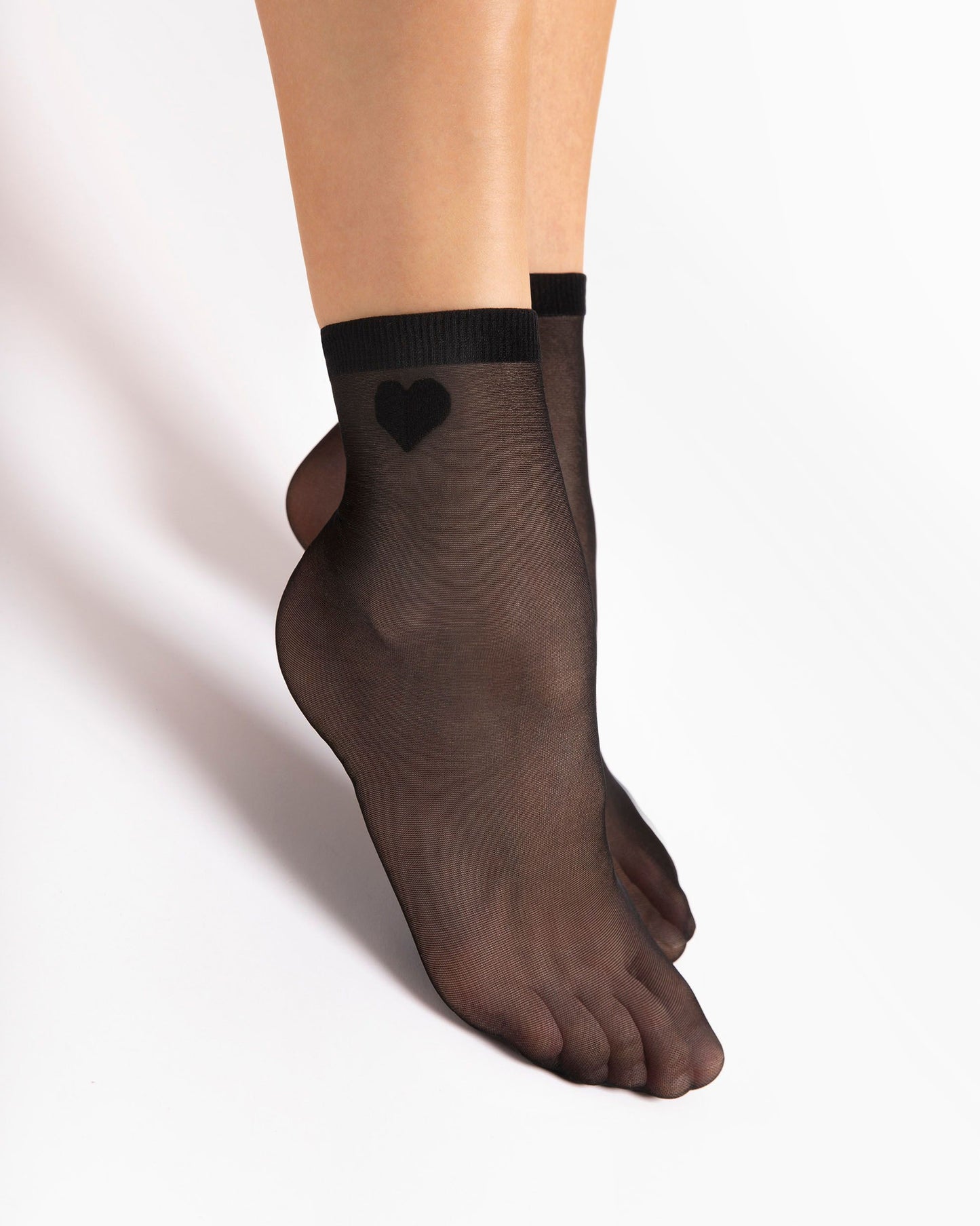 Fiore Cupido 20 Den - Plain sheer black fashion ankle socks with a small woven heart motif on the outside ankle.