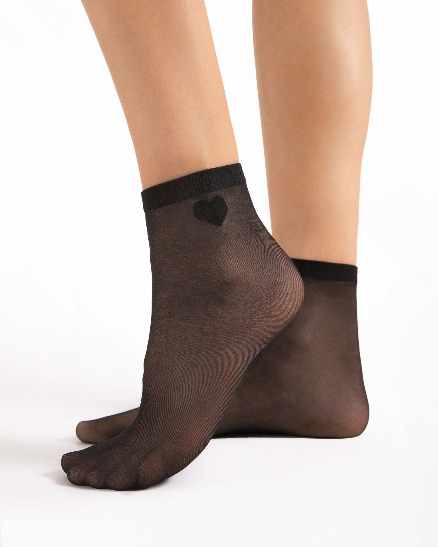 Fiore Cupido 20 Den - Plain sheer black fashion ankle socks with a small woven heart motif on the outside ankle. Side view.