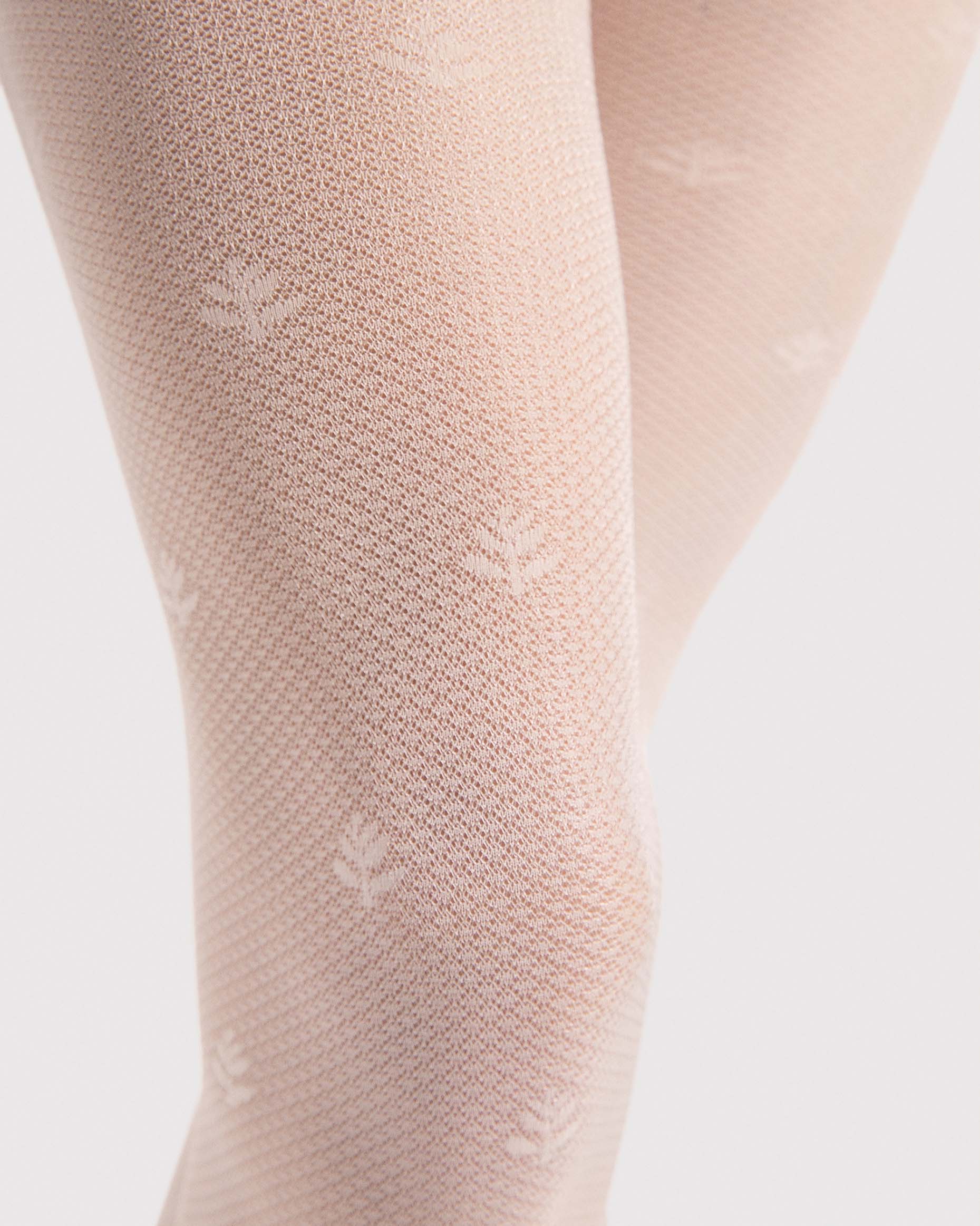 Fiore Lea 30 Den - Cream micro mesh fashion tights with a small flower and stem dotted pattern, geometric linear pattern, close up.