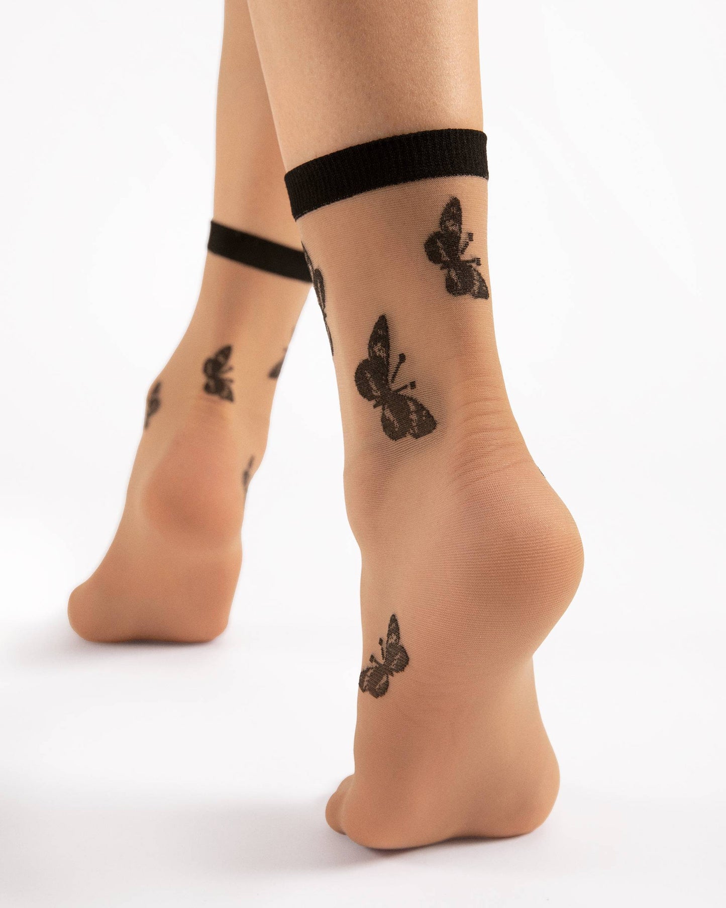 Fiore Summer 15 Den - Sheer nude fashion ankle socks with a butterfly pattern in black, plain black elasticated cuff. Back view.