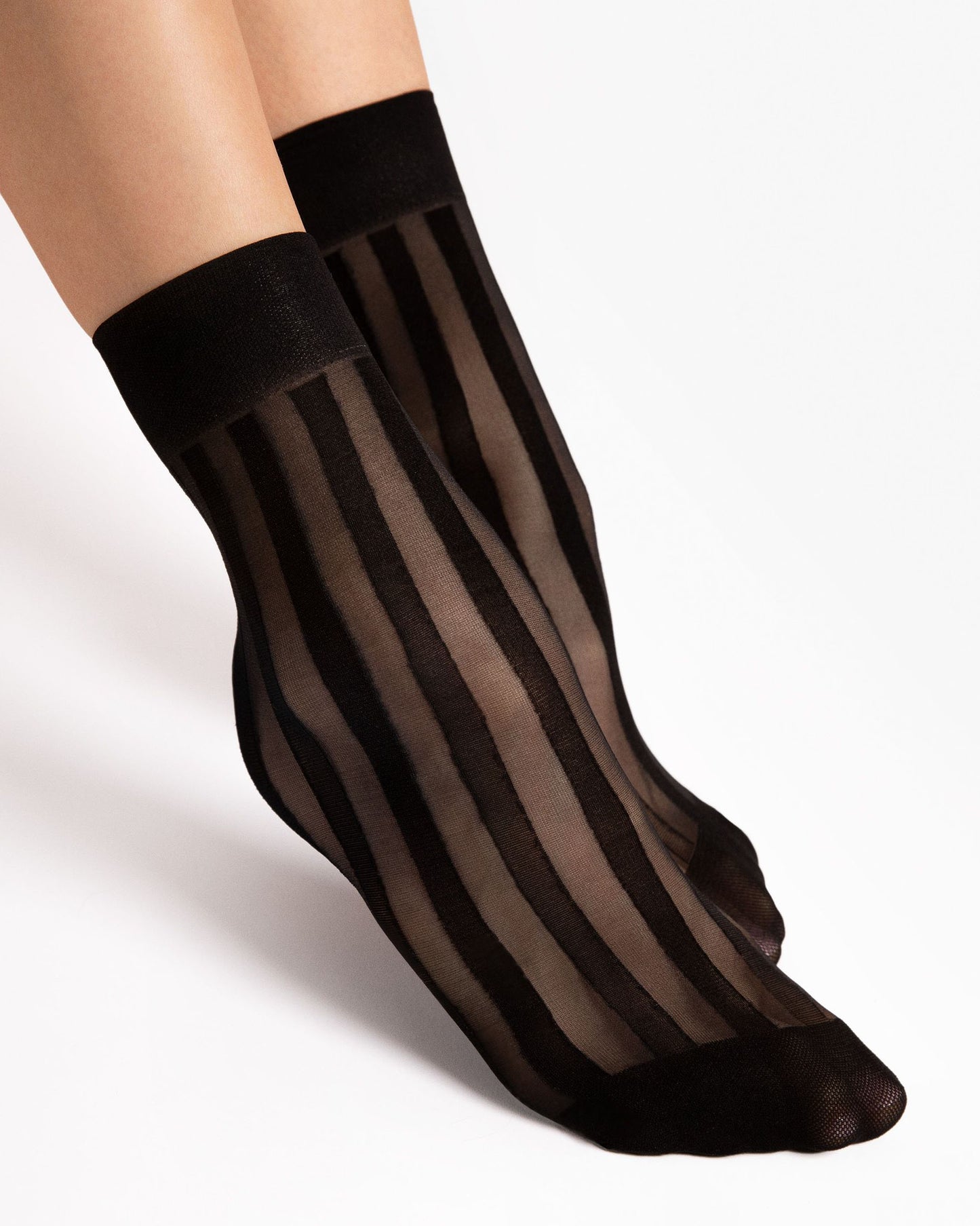 Black sheer striped socks on a white background