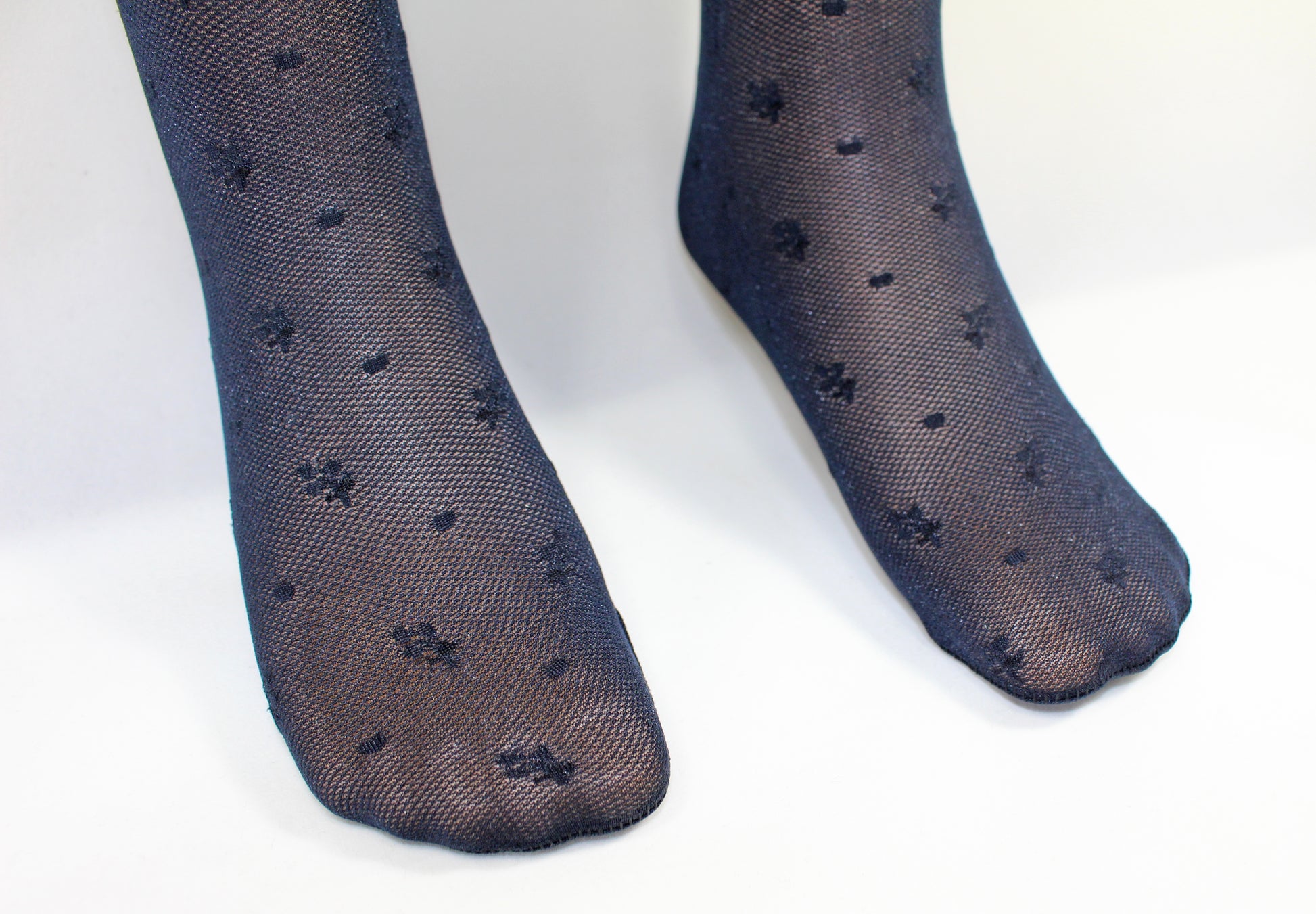 Omsa Cordoba Collant - Navy blue semi opaque micro mesh kid's fashion tights with an all over woven flower and spot pattern and circular lace effect over the knee bands.