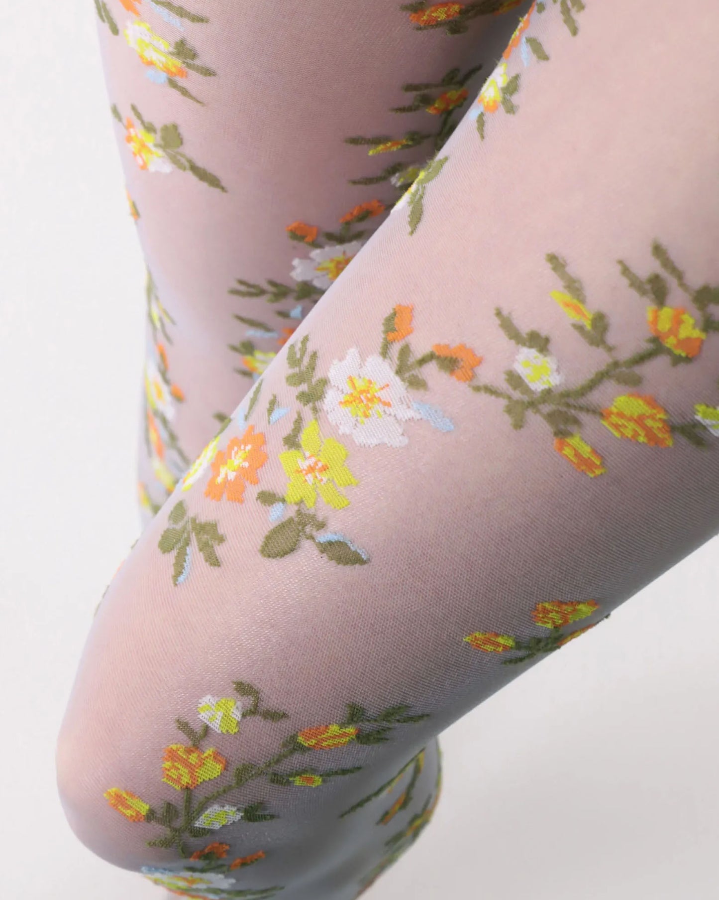 Oroblù Embroidery Collant - Sheer light blue fashion tights with a multicoloured woven floral pattern of orange, yellow, white and green.