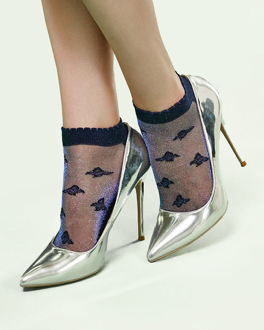 SiSi Butterfly Calzino - Soft low ankle navy sparkly cotton socks with a sheer front, butterfly motif pattern, shaped heal, flat toe seam and scalloped edge cuff. Worn with silver stiletto heels.