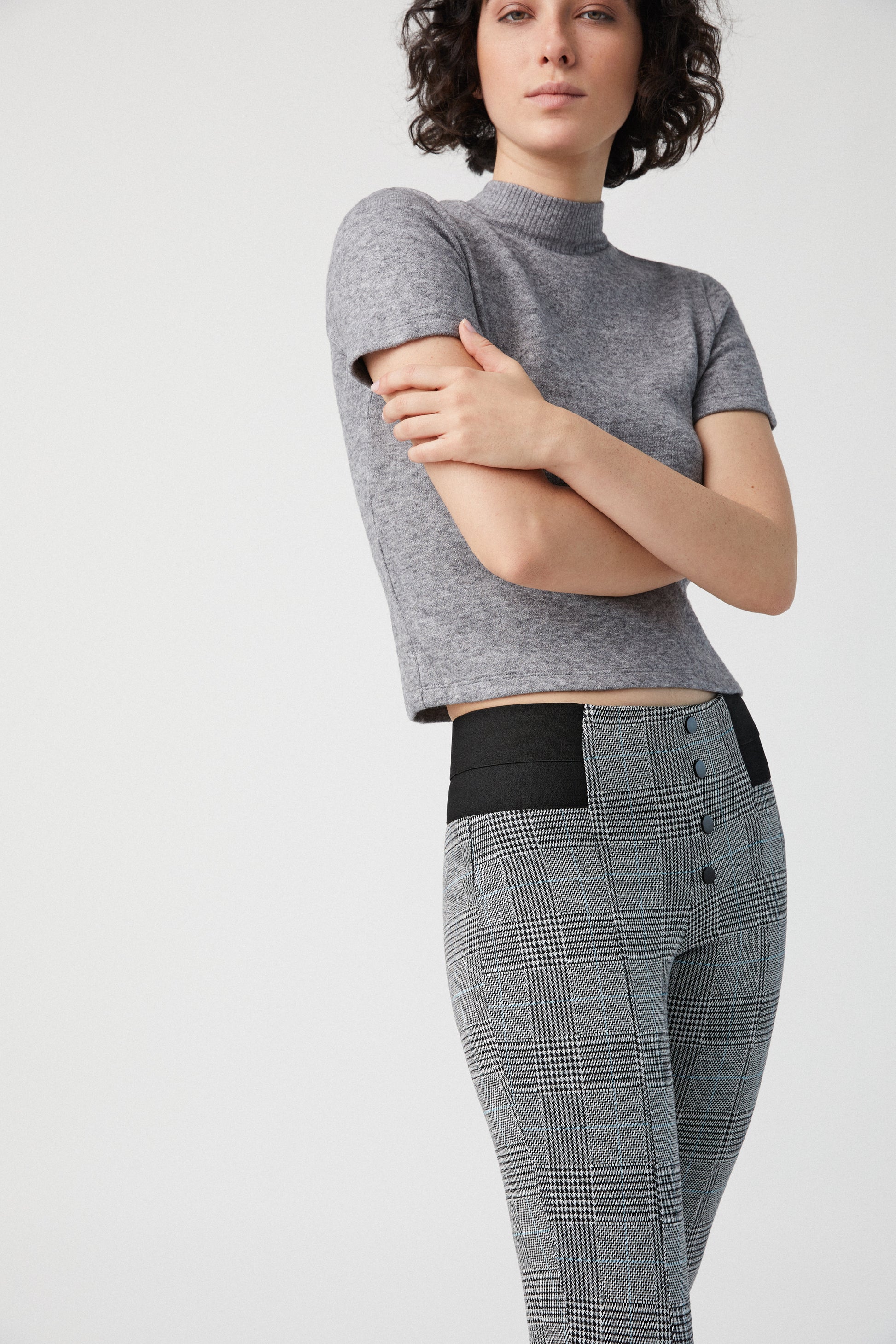 Ysabel Mora 70278 Leggings - High waisted black and white (grey) Prince of Wales tartan trouser leggings (treggings) with a thin stripe of light blue, black faux button closures and deep elasticated slimming waist band.