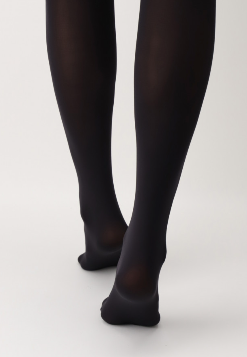 OroblÌ_ Eco 60 Tights - Black opaque tights made from recycled nylon. This tight is soft, matte, has flat seams and cotton gusset. This is a new way of achieving and implementing sustainable living.