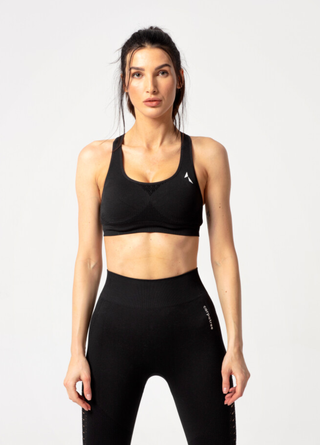 Carpatree Phase Seamless Bra - Black seamless sports bra with removable padding and razor back with crochet style detail.