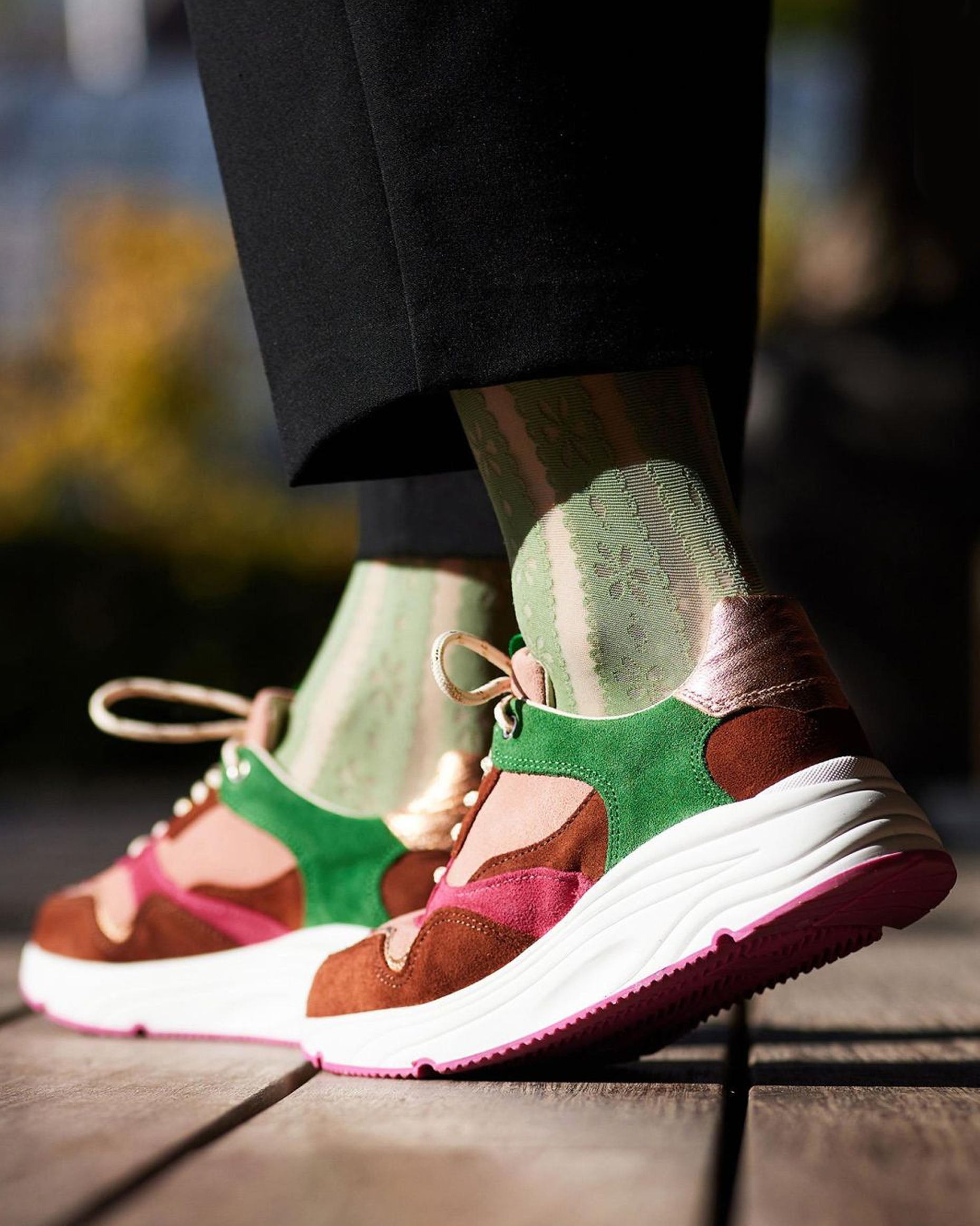 Bonnie Doon Flower Stripe Knee-Highs - Sage green fashion knee-high socks with a vertical stripe pattern with a flower and dot design worn with colourful trainers and cropped black pants.