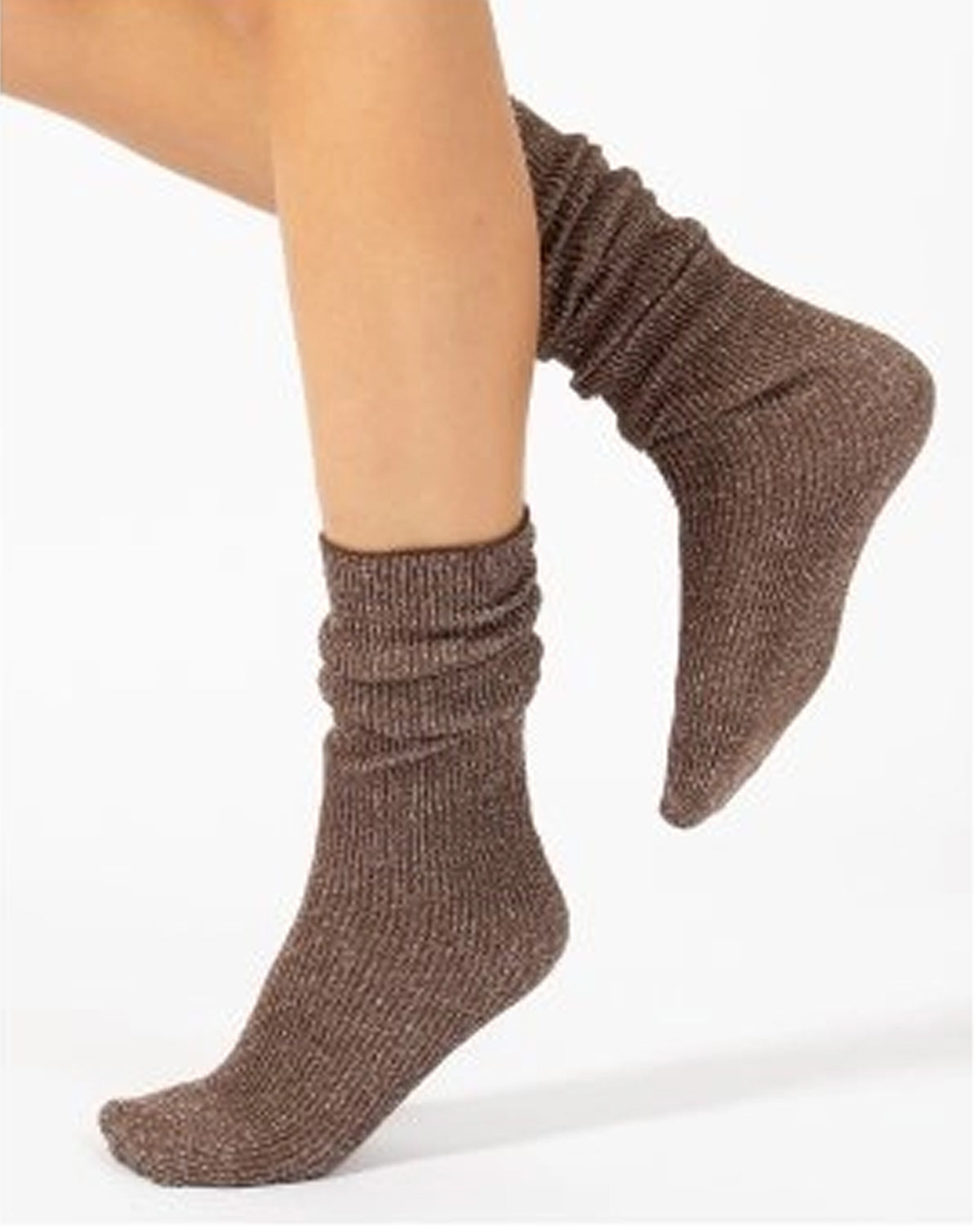 A pair of brown ribbed knit ankle socks worn on a model's feet, shown against a plain white background.