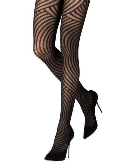 Sheer black patterned tights with a linear swirl pattern, worn with stilettos