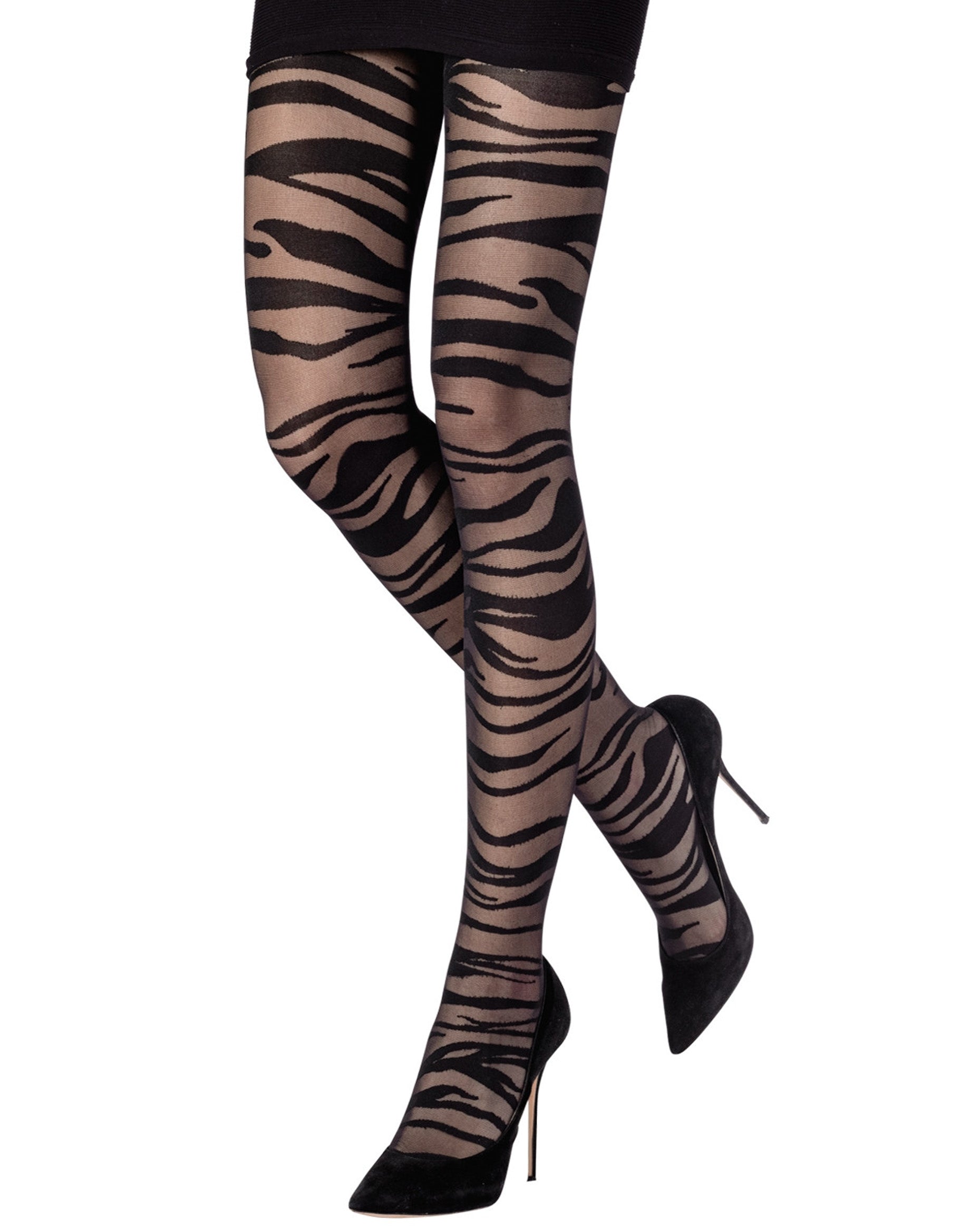Sheer black zebra patterned tights worn with black mini skirt and high heels.