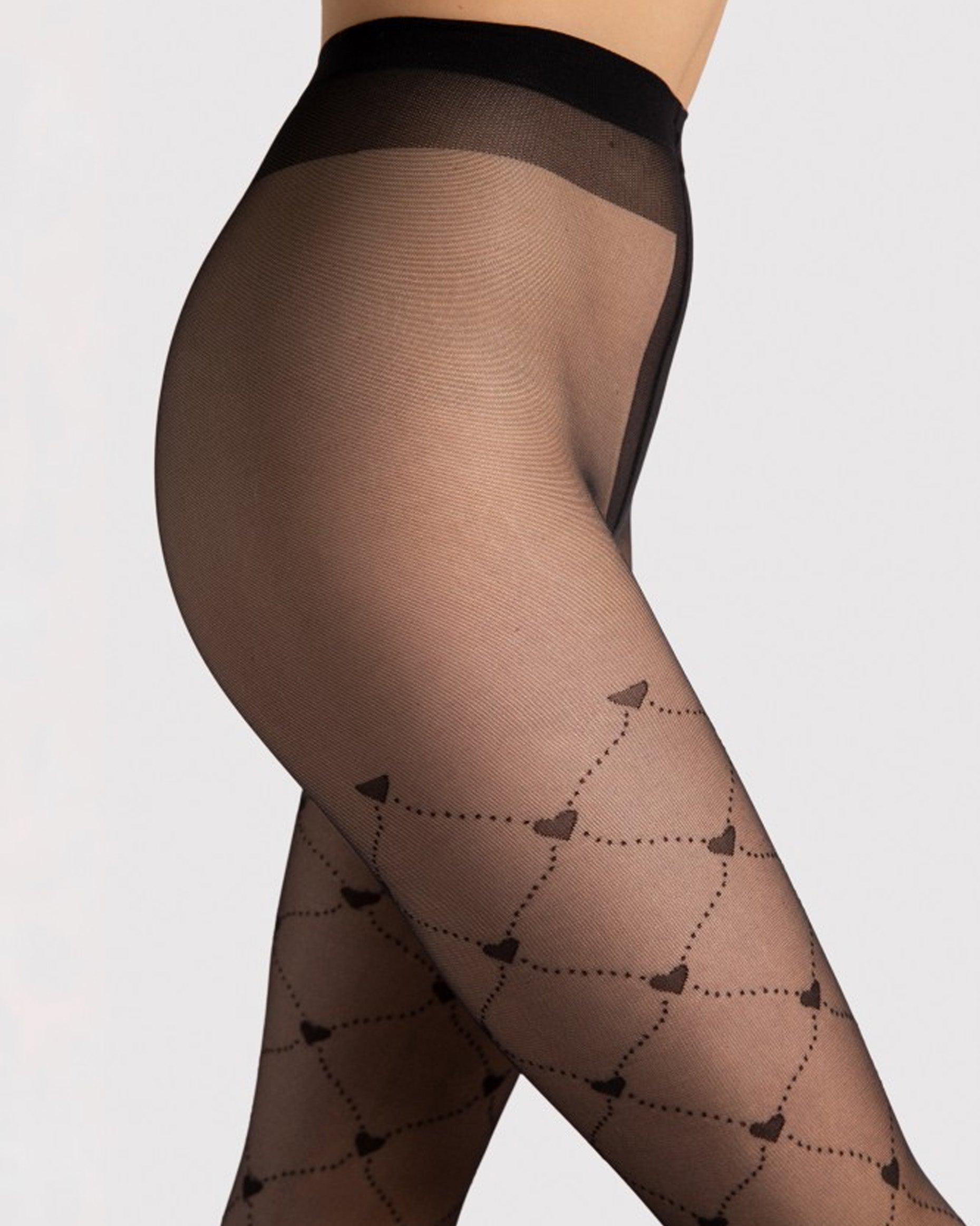 Sheer black fashion tights waist band detail  with a large light dotted fence fishnet style pattern with hearts.