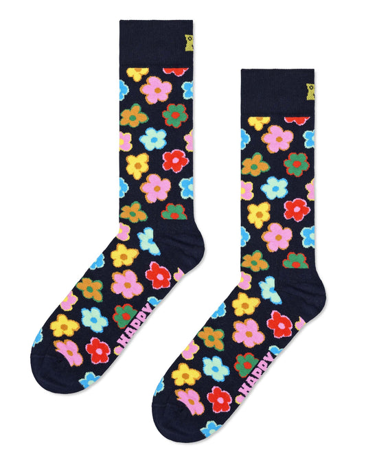Navy cotton crew length ankle socks with an all over colourful sixties style flower pattern.