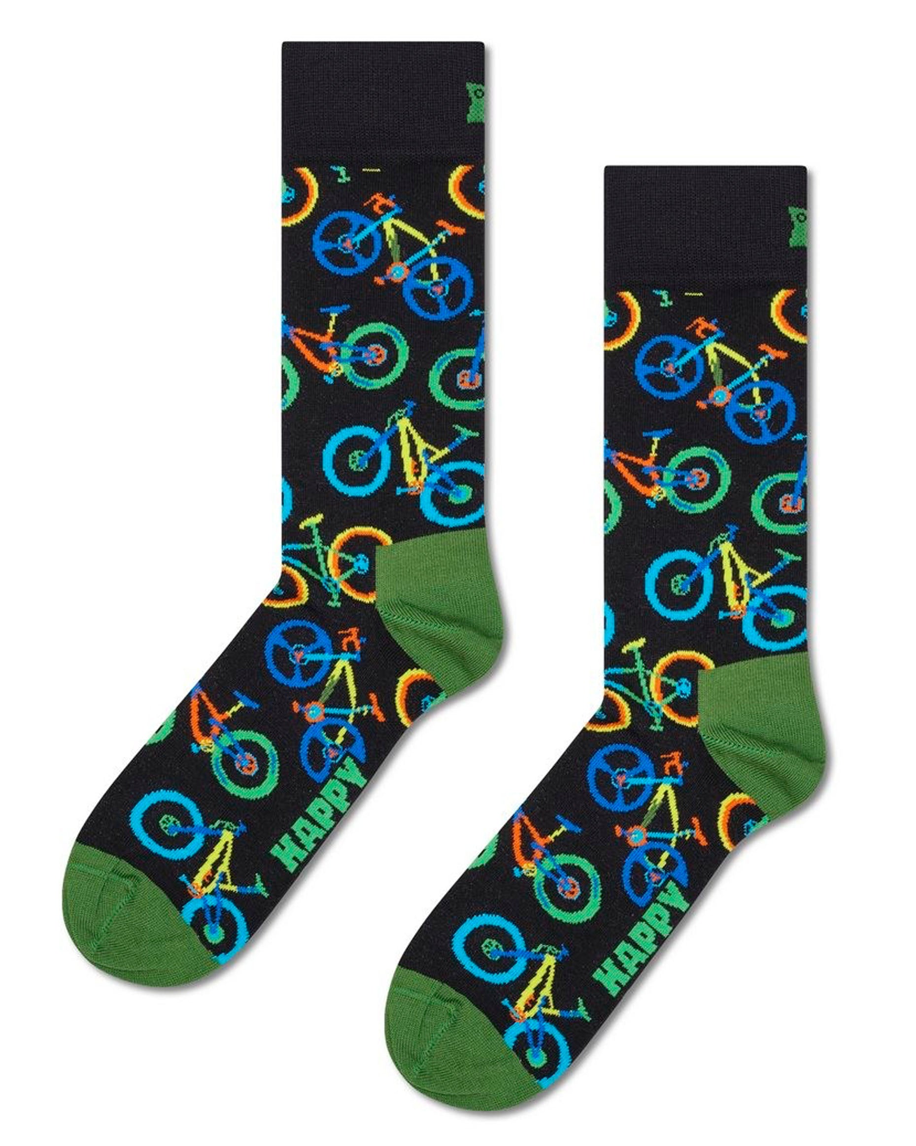 Black cotton crew length ankle socks with an all over multicoloured pattern of mountain bikes in shades of blue, yellow, orange and green and an olive green toe and heel.