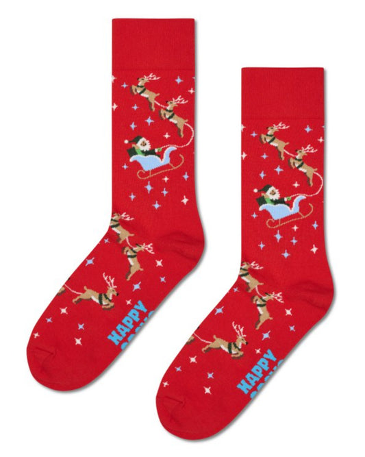 Red cotton crew length ankle socks with Santa in his sleigh and his flying reindeers flying through a starry sky.