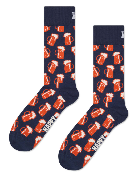 Navy cotton crew length ankle socks with an all over pattern of jugs/steins of foamy beer in orange and white.