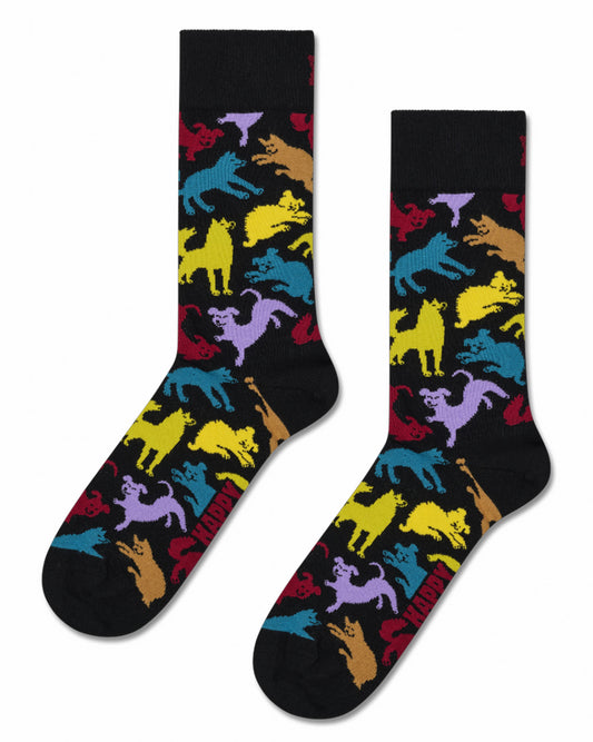 A pair of black crew socks with a colorful repeating pattern of cartoon dog
 silhouettes in yellow, blue, purple, and red, displayed against a plain white background.