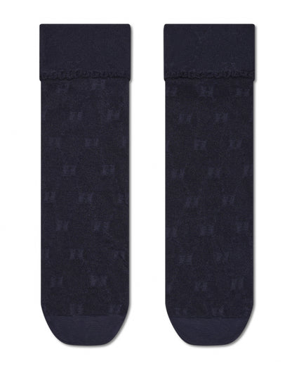 Two black socks with a subtle pattern on a white background
