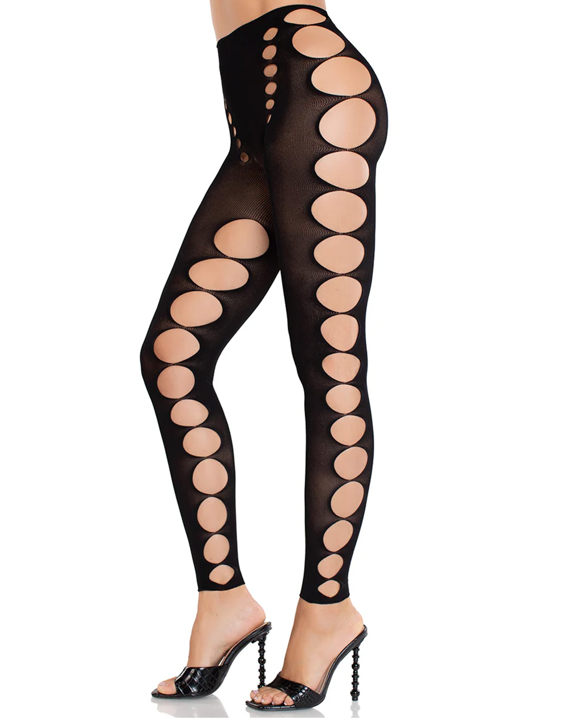 Leg Avenue Cut Out Footless Tights - Black seamless opaque leggings with circular cut-out holes on the inside and outside of the legs. Side view.