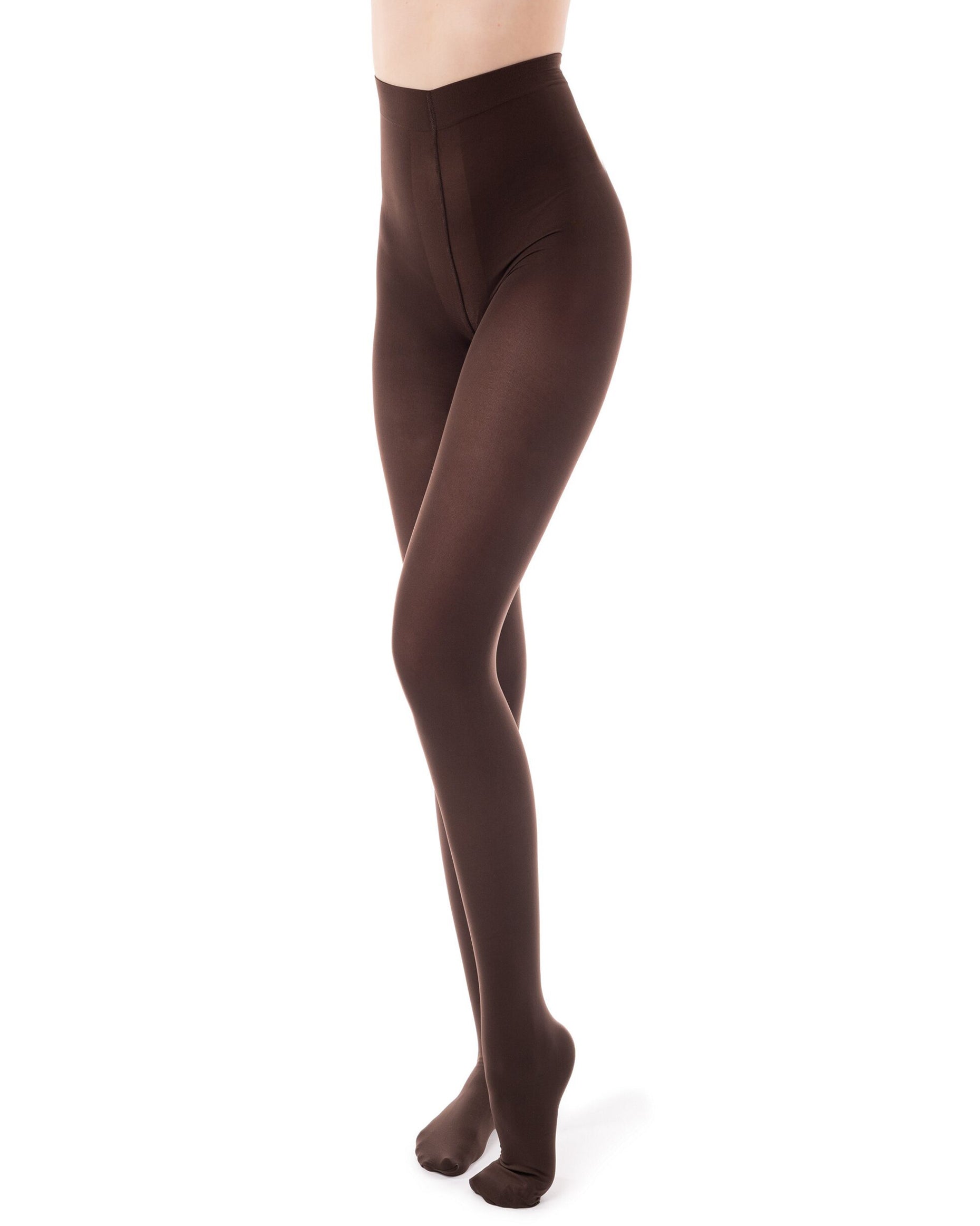 Brown opaque tights worn by a person on a white background