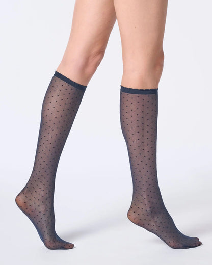 Sheer navy blue tulle-effect knee-highs with micro polka dot pattern and narrow elasticated cuff with scalloped edge.